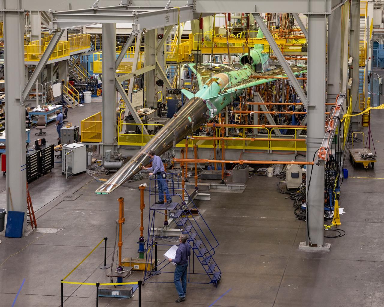 NASA’s X-59 undergoes a structural stress test at Lockheed Martin’s facility  in Fort Worth, Texas. The X-59’s nose makes up one third of the aircraft, at 38-feet in length. The X-59 is a one-of-a-kind airplane designed to fly at supersonic speeds without making a startling sonic boom sound for the communities below. This is part of NASA’s Quesst mission, which plans to help  enable supersonic air travel over land