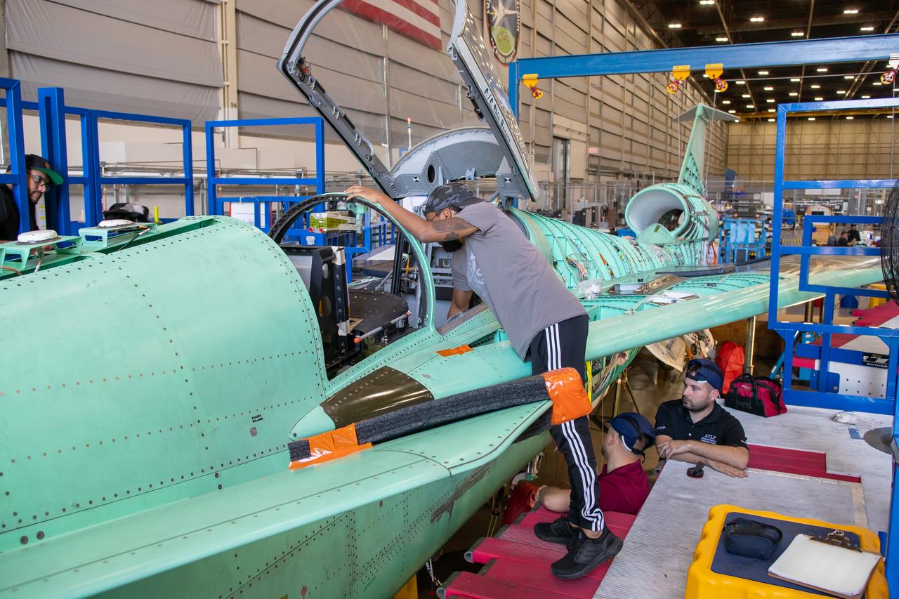 A Lockheed Martin Skunk Works technician inspects some of the wiring and sensors on the X-59 aircraft in preparation for the first power-on system checkouts.  Once complete, the X-59 aircraft will demonstrate the ability to fly supersonic while reducing the loud sonic boom to a quiet sonic thump and help enable commercial supersonic air travel over land. This aircraft is the centerpiece of NASA’s Quesst mission.  