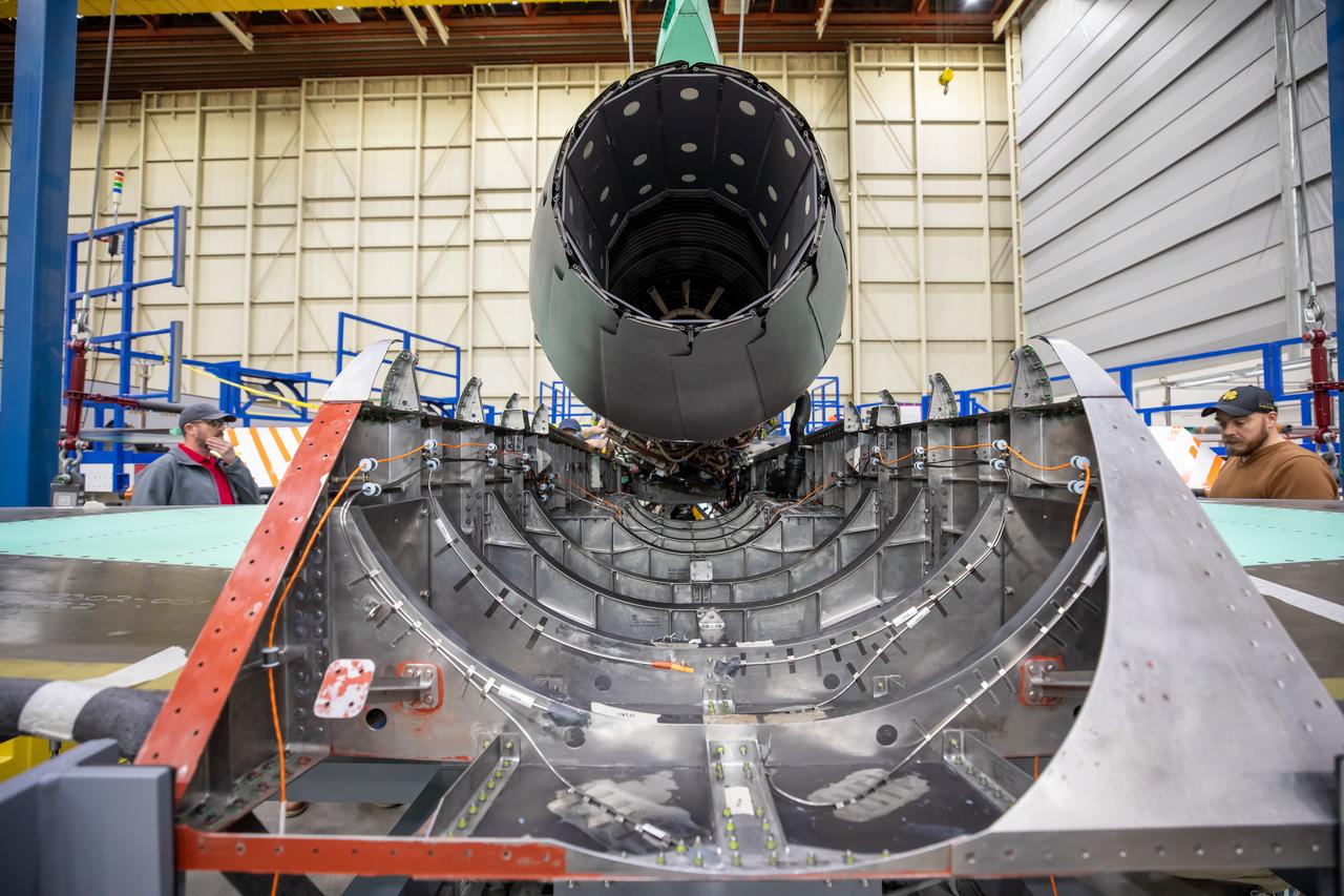 Here is a close-up of the GE F414 engine, from the aft deck or rear, before the tail section of the X-59 is lifted into place and attached to the aircraft. The aft deck helps control the shockwaves at the end of the aircraft and reduce the noise of a sonic boom to more of a sonic thump. 