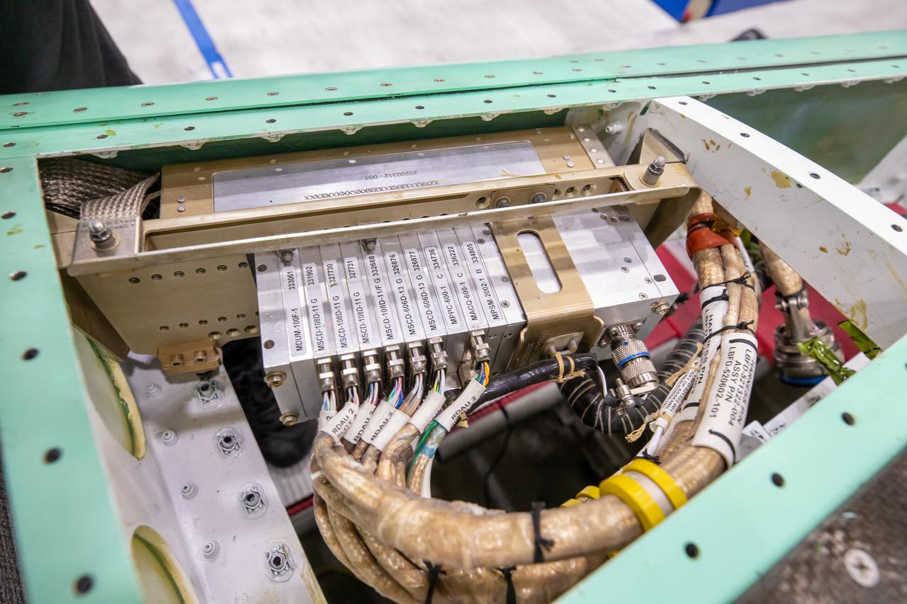 Here is a closeup of some of the X-59’s wiring and instrumentation system. Displayed here is the remote instrumentation encoder, which can be found in the wing of the aircraft. This encoder communicates with the plane’s other instrumentation systems like pressure and temperature sensors within the X-59.