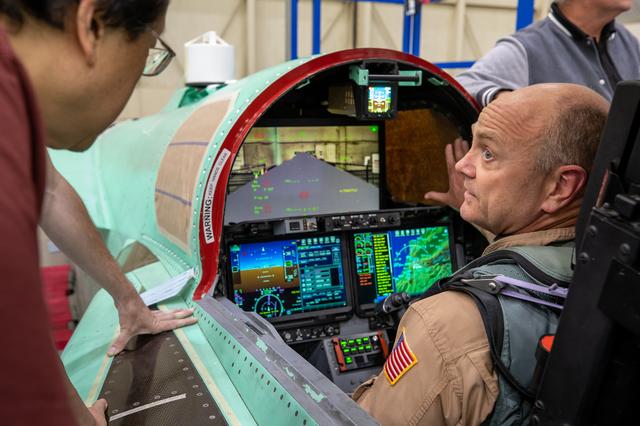 NASA image: Quesst Mission- NASA Test Piot Nils Larson Inspects X-59’s Cockpit