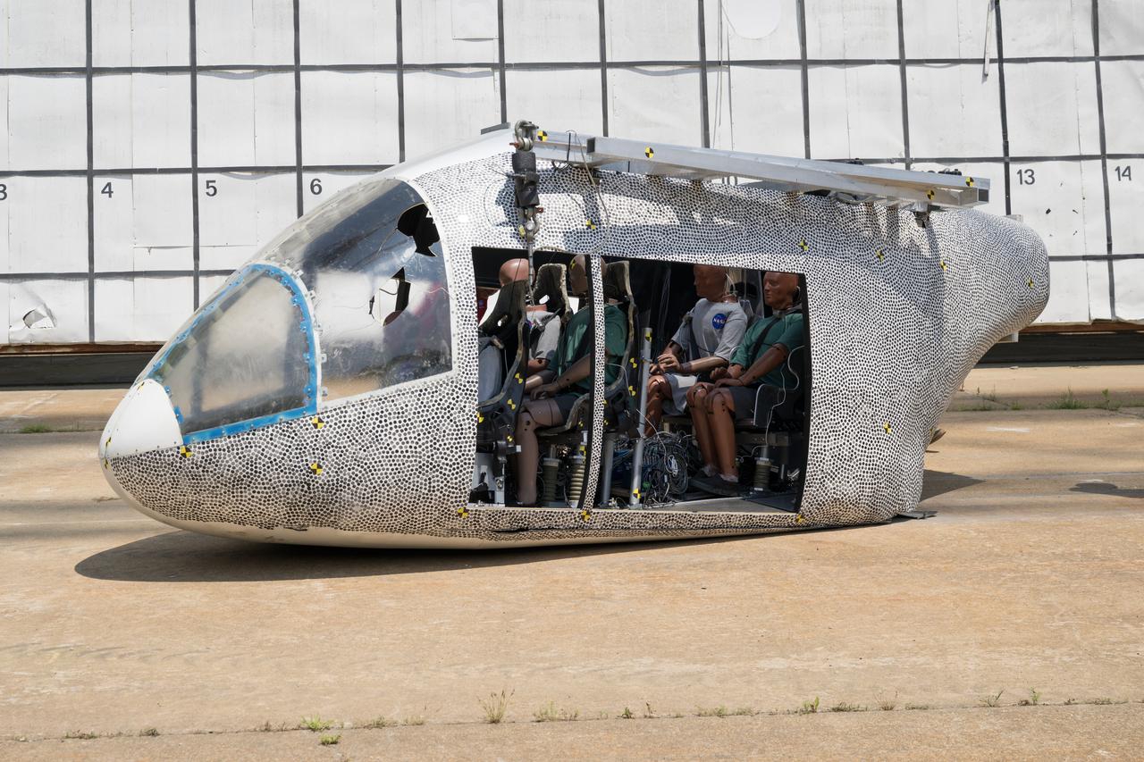 An aircraft body modeled after an air taxi with weighted test dummies inside is shown after a drop test at NASA’s Langley Research Center in Hampton, Virginia. The test was completed June 26 at Langley’s Landing and Impact Research Facility. The aircraft was dropped from a tall steel structure, known as a gantry, after being hoisted about 35 feet in the air by cables. NASA researchers are investigating aircraft materials that best absorb impact forces in a crash.