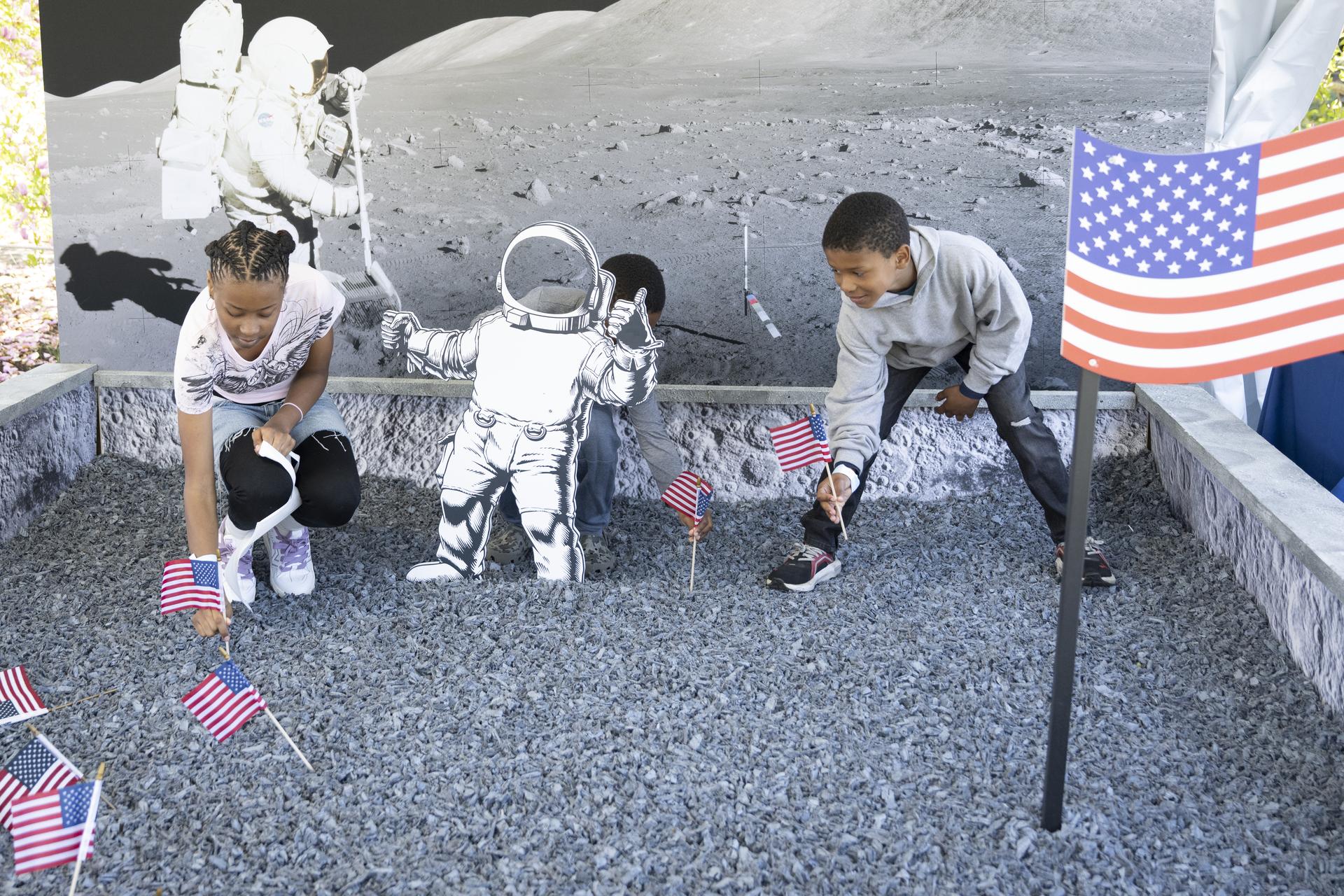 Children explore the NASA Moon Box (Lunar Sandbox) digging for “moon rocks” and planting an American flag, to bringing Artemis exploration to life through curiosity and engagement. during the White House Easter Egg Roll, on the South Lawn in Washington D.C., on April 6, 2026. (Photo Credit: (NASA/Crystal R. Hines)