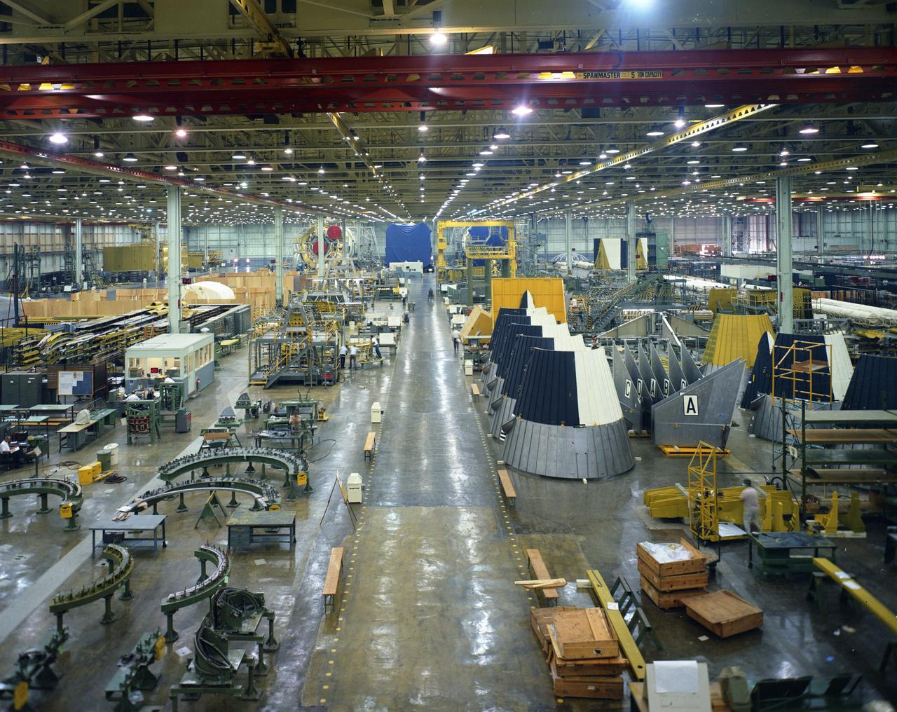 New Orleans, LA - Parts of the Saturn V first stage await assembly at NASA’s Michoud Assembly Facility in October of 1967.  In the far end of the image, S-1C stages are nearing completion. Image dated 10-5-1967.