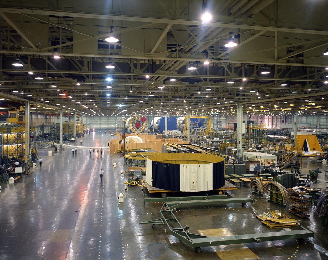 Parts of the Saturn V first stage await assembly at NASA’s Michoud Assembly Facility in October of 1967.  In the far end of the image you can see S-1C stages nearing completion. 