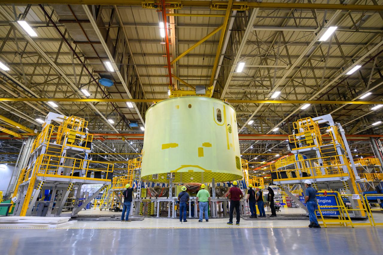 Space Launch System Corestage-2 Engine Section is lifted into a thrust structure tool at NASA's Michoud Assembly Facility.