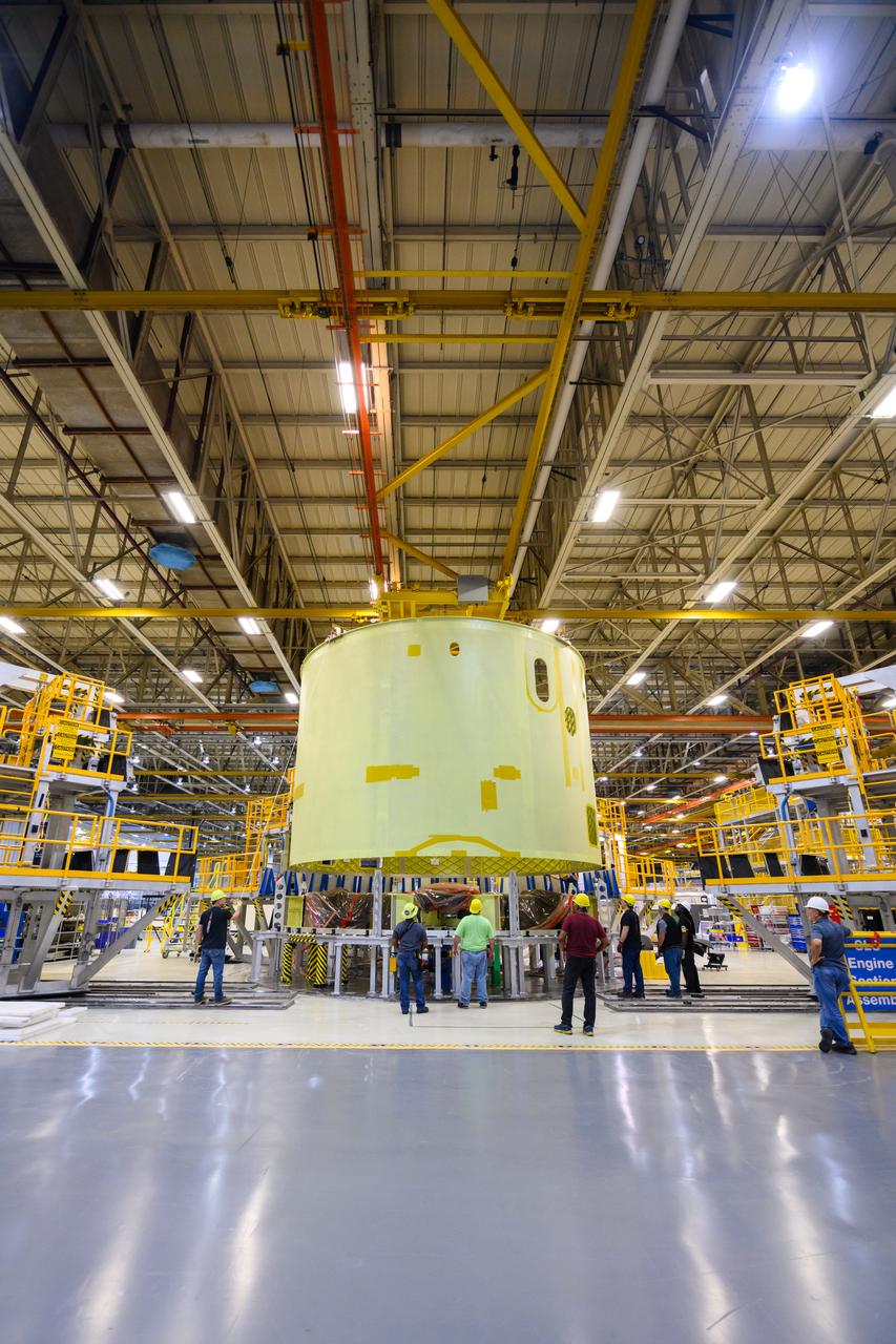 Space Launch System Corestage-2 Engine Section is lifted into a thrust structure tool at NASA's Michoud Assembly Facility.