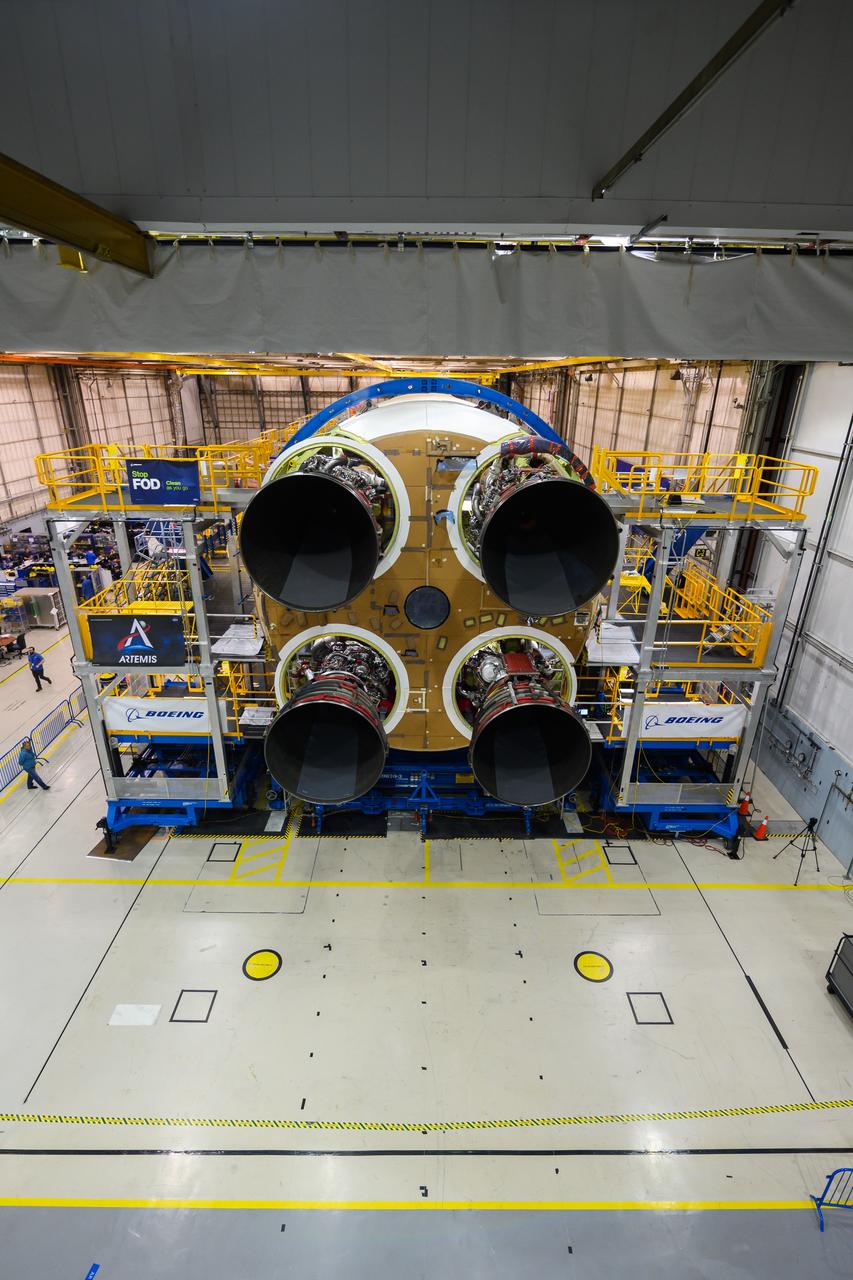 This photo shows all four RS-25 engines attached to the core stage for NASA’s Space Launch System rocket for the agency’s Artemis I mission to the Moon. To complete assembly of the rocket stage, engineers and technicians at NASA’s Michoud Assembly Facility in New Orleans are now integrating the propulsion and electrical systems within the structure. The completed core stage with all four RS-25 engines attached is the largest rocket stage NASA has built since the Saturn V stages for the Apollo Program that first sent Americans to the Moon. The stage, which includes two propellant tanks, provides more than 2 million pounds of thrust to send Artemis I to the Moon. Engineers and technicians attached the fourth RS-25 engine to the rocket stage Nov. 6 just one day after structurally mating the third engine. The first two RS-25 engines were structurally mated to the stage in October. After assembly is complete, crews will conduct an integrated functional test of flight computers, avionics and electrical systems that run throughout the 212-foot-tall core stage in preparation for its completion later this year. This testing is the first time all the flight avionics systems will be tested together to ensure the systems communicate with each other and will perform properly to control the rocket’s flight. Integration of the RS-25 engines to the recently completed core stage structure is a collaborative, multistep process for NASA and its partners Boeing, the core stage lead contractor, and Aerojet Rocketdyne, the RS-25 engines lead contractor.   Offering more payload mass, volume capability and energy to speed missions through space, the SLS rocket, along with NASA’s Gateway in lunar orbit and Orion, is part of NASA’s backbone for deep space exploration and the Artemis lunar program. No other rocket is capable of carrying astronauts in Orion around the Moon in a single mission.