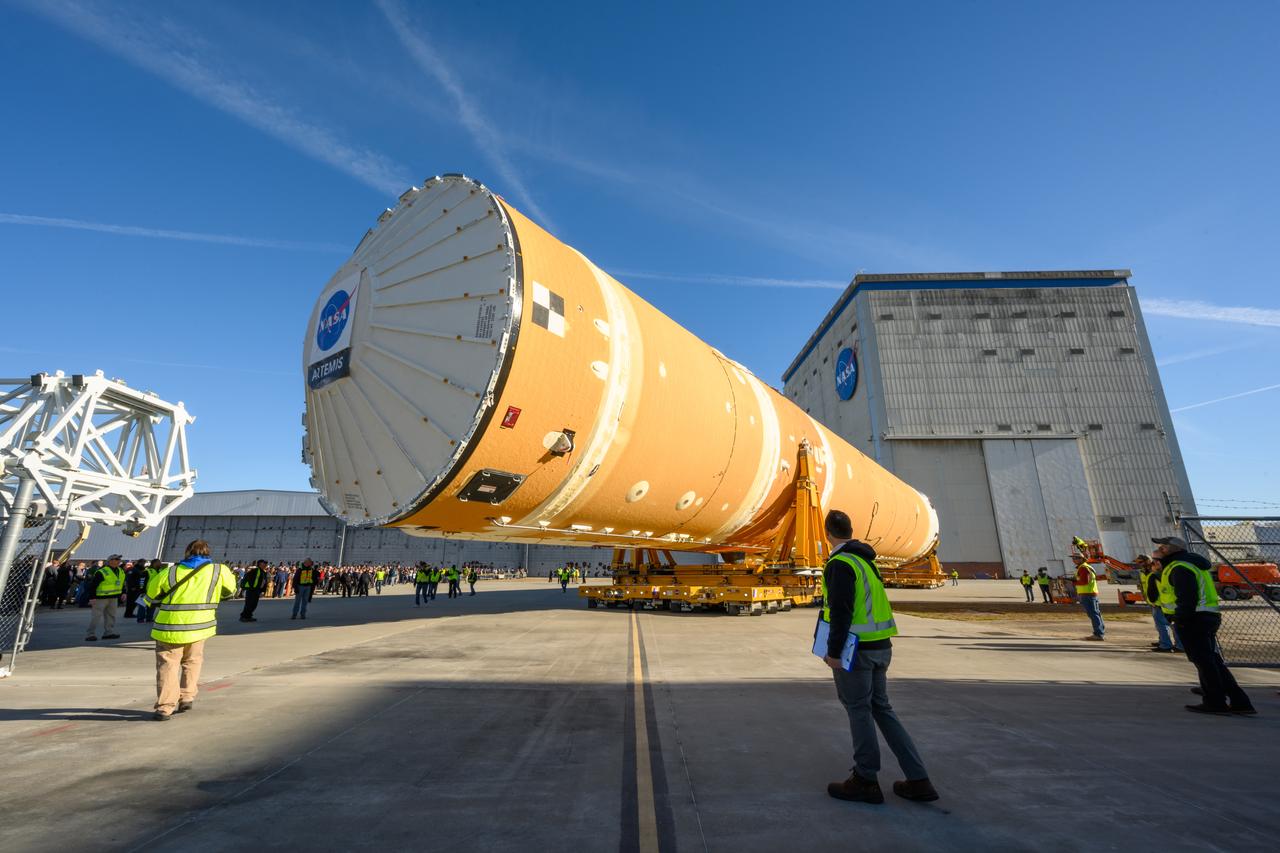 These images show the first core stage for NASA’s Space Launch System rocket inside NASA’s Pegasus barge on Jan. 8 ahead of its forthcoming journey to NASA’s Stennis Space Center near Bay St. Louis, Mississippi. Teams rolled out, or moved, the completed core stage from NASA’s Michoud Assembly Facility in New Orleans to the barge in preparation for the SLS rocket’s core stage Green Run test series at Stennis. Pegasus, which was modified to ferry SLS rocket hardware, will transport the core stage more than 40 miles from Michoud to Stennis for the comprehensive core stage Green Run test series. Green Run, named for its testing of new, or green, hardware progressively is the final test campaign ahead of the first Artemis launch.  Assembly and integration of the core stage and its four RS-25 engines has been a collaborative, multistep process for NASA and its partners Boeing, the core stage lead contractor, and Aerojet Rocketdyne, the RS-25 engines lead contractor. Together with four RS-25 engines, the rocket’s massive 212-foot-tall core stage — the largest stage NASA has ever built — and its twin solid rocket boosters will produce 8.8 million pounds of thrust to send NASA’s Orion spacecraft, astronauts and supplies beyond Earth’s orbit to the Moon and, ultimately, Mars. Offering more payload mass, volume capability and energy to speed missions through space, the SLS rocket, along with NASA’s Gateway in lunar orbit and Orion, is part of NASA’s backbone for deep space exploration and the Artemis lunar program. 