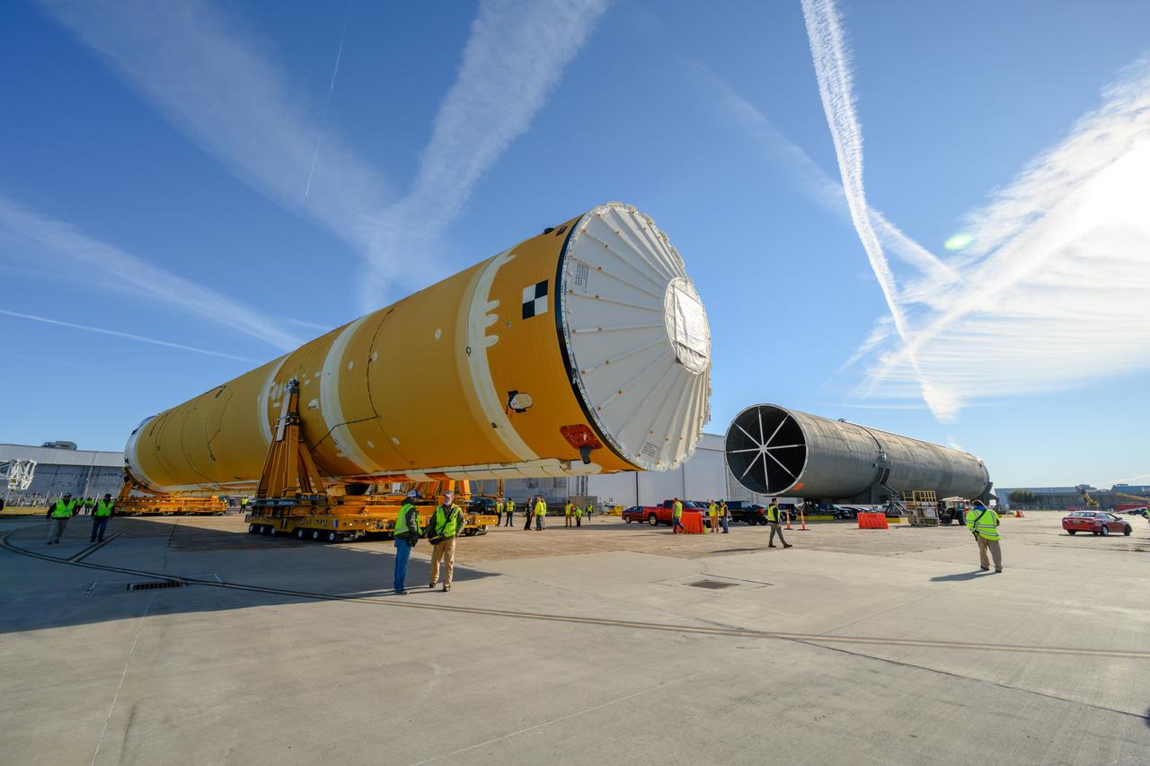 These images show the first core stage for NASA’s Space Launch System rocket inside NASA’s Pegasus barge on Jan. 8 ahead of its forthcoming journey to NASA’s Stennis Space Center near Bay St. Louis, Mississippi. Teams rolled out, or moved, the completed core stage from NASA’s Michoud Assembly Facility in New Orleans to the barge in preparation for the SLS rocket’s core stage Green Run test series at Stennis. Pegasus, which was modified to ferry SLS rocket hardware, will transport the core stage more than 40 miles from Michoud to Stennis for the comprehensive core stage Green Run test series. Green Run, named for its testing of new, or green, hardware progressively is the final test campaign ahead of the first Artemis launch.  Assembly and integration of the core stage and its four RS-25 engines has been a collaborative, multistep process for NASA and its partners Boeing, the core stage lead contractor, and Aerojet Rocketdyne, the RS-25 engines lead contractor. Together with four RS-25 engines, the rocket’s massive 212-foot-tall core stage — the largest stage NASA has ever built — and its twin solid rocket boosters will produce 8.8 million pounds of thrust to send NASA’s Orion spacecraft, astronauts and supplies beyond Earth’s orbit to the Moon and, ultimately, Mars. Offering more payload mass, volume capability and energy to speed missions through space, the SLS rocket, along with NASA’s Gateway in lunar orbit and Orion, is part of NASA’s backbone for deep space exploration and the Artemis lunar program. 