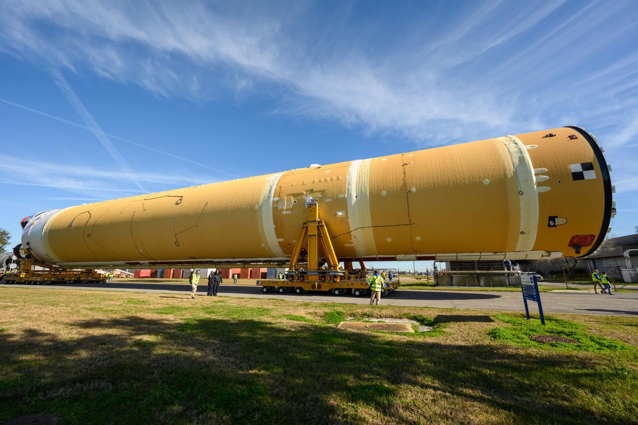 These images show the first core stage for NASA’s Space Launch System rocket inside NASA’s Pegasus barge on Jan. 8 ahead of its forthcoming journey to NASA’s Stennis Space Center near Bay St. Louis, Mississippi. Teams rolled out, or moved, the completed core stage from NASA’s Michoud Assembly Facility in New Orleans to the barge in preparation for the SLS rocket’s core stage Green Run test series at Stennis. Pegasus, which was modified to ferry SLS rocket hardware, will transport the core stage more than 40 miles from Michoud to Stennis for the comprehensive core stage Green Run test series. Green Run, named for its testing of new, or green, hardware progressively is the final test campaign ahead of the first Artemis launch.  Assembly and integration of the core stage and its four RS-25 engines has been a collaborative, multistep process for NASA and its partners Boeing, the core stage lead contractor, and Aerojet Rocketdyne, the RS-25 engines lead contractor. Together with four RS-25 engines, the rocket’s massive 212-foot-tall core stage — the largest stage NASA has ever built — and its twin solid rocket boosters will produce 8.8 million pounds of thrust to send NASA’s Orion spacecraft, astronauts and supplies beyond Earth’s orbit to the Moon and, ultimately, Mars. Offering more payload mass, volume capability and energy to speed missions through space, the SLS rocket, along with NASA’s Gateway in lunar orbit and Orion, is part of NASA’s backbone for deep space exploration and the Artemis lunar program. 