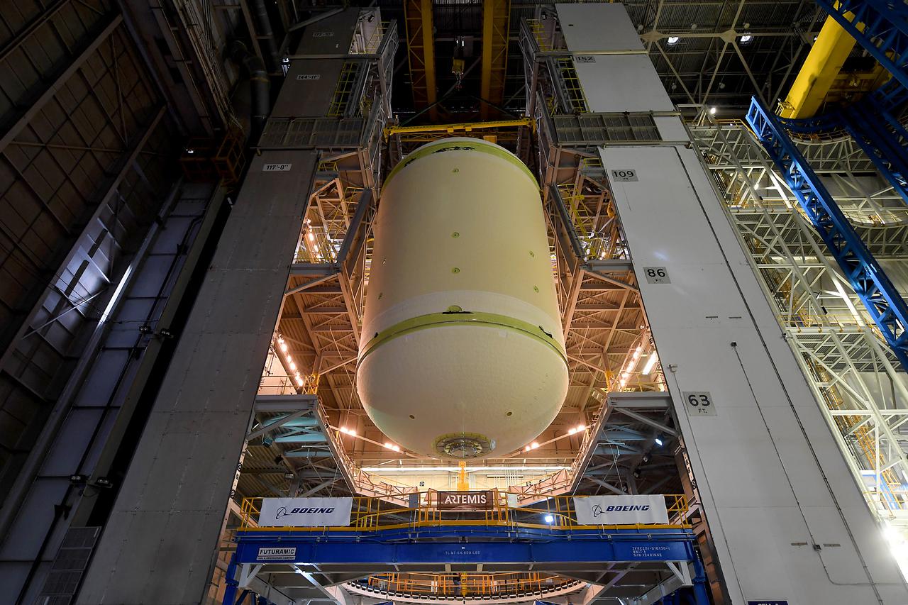 This image highlights the liquid oxygen tank, which will be used on the core stage of NASA’ Space Launch System rocket for Artemis II, the first crewed mission of NASA’s Artemis program, at NASA’s Michoud Assembly Facility. The SLS core stage is made up of five unique elements: the forward skirt, liquid oxygen tank, intertank, liquid hydrogen tank, and the engine section. The forward skirt houses flight computers, cameras, and avionics systems. The liquid oxygen tank holds 196,000 gallons of liquid oxygen cooled to minus 297 degrees Fahrenheit. The LOX hardware sits between the core stage’s forward skirt and the intertank. Along with the liquid hydrogen tank, it will provide fuel to the four RS-25 engines at the bottom of the core stage to produce more than two million pounds of thrust to launch NASA’s Artemis missions to the Moon.     Together with its four RS-25 engines, the rocket’s massive 212-foot-tall core stage — the largest stage NASA has ever built — and its twin solid rocket boosters will produce 8.8 million pounds of thrust to send NASA’s Orion spacecraft, astronauts and supplies beyond Earth’s orbit to the Moon and, ultimately, Mars. Offering more payload mass, volume capability and energy to speed missions through space, the SLS rocket, along with NASA’s Gateway in lunar orbit, the Human Landing System, and Orion spacecraft, is part of NASA’s backbone for deep space exploration and the Artemis lunar program. No other rocket can send astronauts in Orion around the Moon in a single mission.