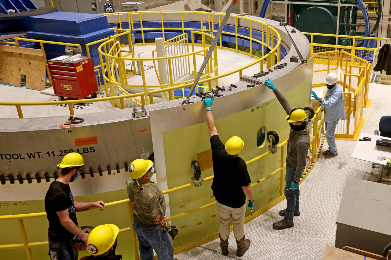 Technicians at NASA’s Michoud Assembly Facility move a piece of the engine section of NASA’s Space Launch System rocket for Artemis III in preparation for its next step in production. This hardware is the first large piece manufactured for the Artemis III mission and makes up the lowest portion of the 212-foot-tall core stage. When complete, the engine section will house the four RS-25 engines and include vital systems for mounting, controlling and delivering fuel from the propellant tanks to the rocket’s engines.   Together with its four RS-25 engines and its twin solid rocket boosters, it will produce 8.8 million pounds of thrust to send NASA’s Orion spacecraft, astronauts, and supplies beyond Earth’s orbit to the Moon and, ultimately, Mars. Offering more payload mass, volume capability, and energy to speed missions through space, the SLS rocket, along with NASA’s Gateway in lunar orbit, the Human Landing System, and Orion spacecraft, is part of NASA’s backbone for deep space exploration and the Artemis lunar program. No other rocket is capable of carrying astronauts in Orion around the Moon in a single mission.  