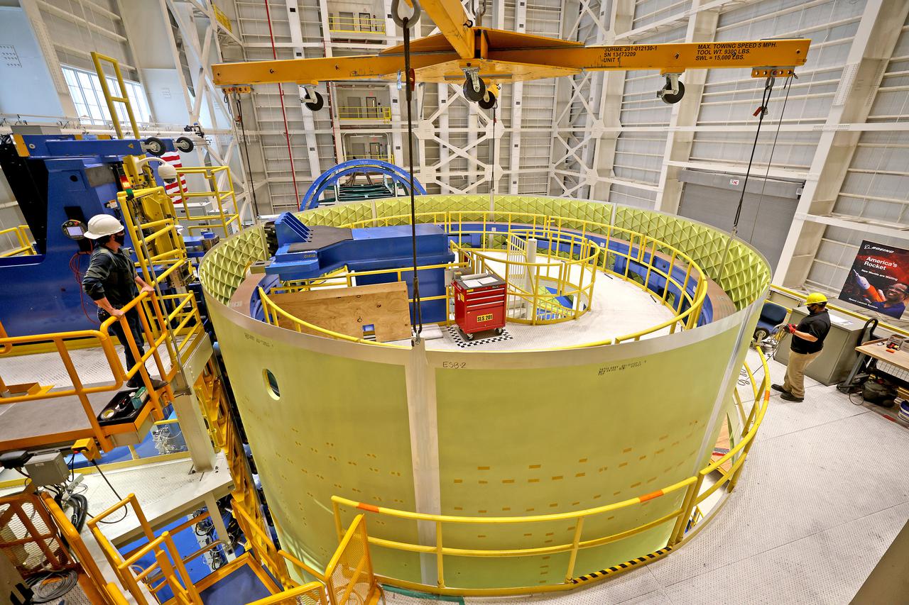 Technicians at NASA’s Michoud Assembly Facility move the engine section of NASA’s Space Launch System rocket for Artemis III in preparation for its next step in production. This hardware is the first large piece manufactured for the Artemis III mission and makes up the lowest portion of the 212-foot-tall core stage. When complete, the engine section will house the four RS-25 engines and include vital systems for mounting, controlling and delivering fuel from the propellant tanks to the rocket’s engines.   Together with its four RS-25 engines and its twin solid rocket boosters, it will produce 8.8 million pounds of thrust to send NASA’s Orion spacecraft, astronauts, and supplies beyond Earth’s orbit to the Moon and, ultimately, Mars. Offering more payload mass, volume capability, and energy to speed missions through space, the SLS rocket, along with NASA’s Gateway in lunar orbit, the Human Landing System, and Orion spacecraft, is part of NASA’s backbone for deep space exploration and the Artemis lunar program. No other rocket is capable of carrying astronauts in Orion around the Moon in a single mission.  
