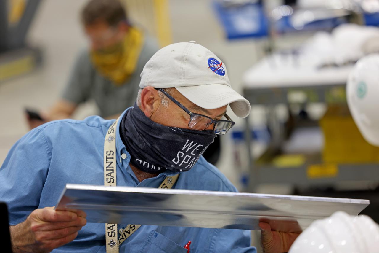 At NASA’s Michoud Assembly Facility in New Orleans, technicians from Orion prime contractor Lockheed Martin have welded together three cone-shaped panels on Orion’s crew module for the Artemis III mission that will land the first woman and next man on the Moon.  The crew module’s primary structure, the pressure vessel, is comprised of seven machined aluminum alloy pieces that are welded together through a weld process that produces a strong, air-tight habitable space for astronauts during the mission. The pressure vessel is designed to withstand the harsh and demanding environment of deep space, and is the core structure upon which all the other elements of Orion’s crew module are integrated.  Infographic showing the seven pieces of Orion's underlying structure  With welding complete on the crew module cone panels – one of which contains windows providing astronauts views of the Moon and Earth – work will begin joining the forward bulkhead to the tunnel to create the top of the spacecraft, followed by the barrel and aft bulkhead join to form the bottom of Orion.  Last, the forward bulkhead will be welded to the top of the panels and, for the seventh and closeout weld, the bottom of the cone panels will be joined to the barrel to complete the pressure vessel. Once welding of the Artemis III crew module primary structure is complete, it will be shipped to NASA’s Kennedy Space Center in Florida where it will undergo further assembly beginning this fall.  Orion, the Space Launch System, and Exploration Ground Systems programs are foundational elements of the Artemis program. Artemis I will be the first integrated flight test of Orion and SLS and is targeted to launch later this year. Artemis II will follow and is the first crewed mission, taking humans farther into space than ever before. Image credit: NASA/Michael DeMocker