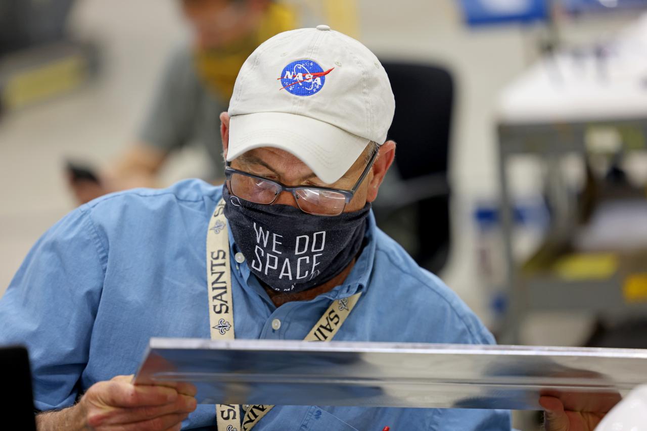 At NASA’s Michoud Assembly Facility in New Orleans, technicians from Orion prime contractor Lockheed Martin have welded together three cone-shaped panels on Orion’s crew module for the Artemis III mission that will land the first woman and next man on the Moon.  The crew module’s primary structure, the pressure vessel, is comprised of seven machined aluminum alloy pieces that are welded together through a weld process that produces a strong, air-tight habitable space for astronauts during the mission. The pressure vessel is designed to withstand the harsh and demanding environment of deep space, and is the core structure upon which all the other elements of Orion’s crew module are integrated.  Infographic showing the seven pieces of Orion's underlying structure  With welding complete on the crew module cone panels – one of which contains windows providing astronauts views of the Moon and Earth – work will begin joining the forward bulkhead to the tunnel to create the top of the spacecraft, followed by the barrel and aft bulkhead join to form the bottom of Orion.  Last, the forward bulkhead will be welded to the top of the panels and, for the seventh and closeout weld, the bottom of the cone panels will be joined to the barrel to complete the pressure vessel. Once welding of the Artemis III crew module primary structure is complete, it will be shipped to NASA’s Kennedy Space Center in Florida where it will undergo further assembly beginning this fall.  Orion, the Space Launch System, and Exploration Ground Systems programs are foundational elements of the Artemis program. Artemis I will be the first integrated flight test of Orion and SLS and is targeted to launch later this year. Artemis II will follow and is the first crewed mission, taking humans farther into space than ever before. Image credit: NASA/Michael DeMocker