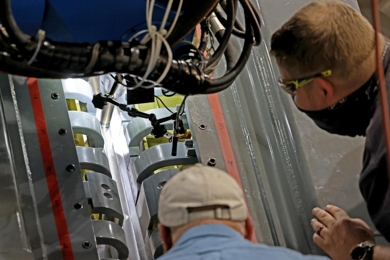 At NASA’s Michoud Assembly Facility in New Orleans, technicians from Orion prime contractor Lockheed Martin have welded together three cone-shaped panels on Orion’s crew module for the Artemis III mission that will land the first woman and next man on the Moon.  The crew module’s primary structure, the pressure vessel, is comprised of seven machined aluminum alloy pieces that are welded together through a weld process that produces a strong, air-tight habitable space for astronauts during the mission. The pressure vessel is designed to withstand the harsh and demanding environment of deep space, and is the core structure upon which all the other elements of Orion’s crew module are integrated.  Infographic showing the seven pieces of Orion's underlying structure  With welding complete on the crew module cone panels – one of which contains windows providing astronauts views of the Moon and Earth – work will begin joining the forward bulkhead to the tunnel to create the top of the spacecraft, followed by the barrel and aft bulkhead join to form the bottom of Orion.  Last, the forward bulkhead will be welded to the top of the panels and, for the seventh and closeout weld, the bottom of the cone panels will be joined to the barrel to complete the pressure vessel. Once welding of the Artemis III crew module primary structure is complete, it will be shipped to NASA’s Kennedy Space Center in Florida where it will undergo further assembly beginning this fall.  Orion, the Space Launch System, and Exploration Ground Systems programs are foundational elements of the Artemis program. Artemis I will be the first integrated flight test of Orion and SLS and is targeted to launch later this year. Artemis II will follow and is the first crewed mission, taking humans farther into space than ever before. Image credit: NASA/Michael DeMocker
