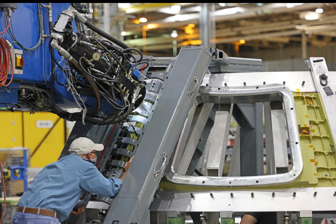 At NASA’s Michoud Assembly Facility in New Orleans, technicians from Orion prime contractor Lockheed Martin have welded together three cone-shaped panels on Orion’s crew module for the Artemis III mission that will land the first woman and next man on the Moon.  The crew module’s primary structure, the pressure vessel, is comprised of seven machined aluminum alloy pieces that are welded together through a weld process that produces a strong, air-tight habitable space for astronauts during the mission. The pressure vessel is designed to withstand the harsh and demanding environment of deep space, and is the core structure upon which all the other elements of Orion’s crew module are integrated.  Infographic showing the seven pieces of Orion's underlying structure  With welding complete on the crew module cone panels – one of which contains windows providing astronauts views of the Moon and Earth – work will begin joining the forward bulkhead to the tunnel to create the top of the spacecraft, followed by the barrel and aft bulkhead join to form the bottom of Orion.  Last, the forward bulkhead will be welded to the top of the panels and, for the seventh and closeout weld, the bottom of the cone panels will be joined to the barrel to complete the pressure vessel. Once welding of the Artemis III crew module primary structure is complete, it will be shipped to NASA’s Kennedy Space Center in Florida where it will undergo further assembly beginning this fall.  Orion, the Space Launch System, and Exploration Ground Systems programs are foundational elements of the Artemis program. Artemis I will be the first integrated flight test of Orion and SLS and is targeted to launch later this year. Artemis II will follow and is the first crewed mission, taking humans farther into space than ever before. Image credit: NASA/Michael DeMocker