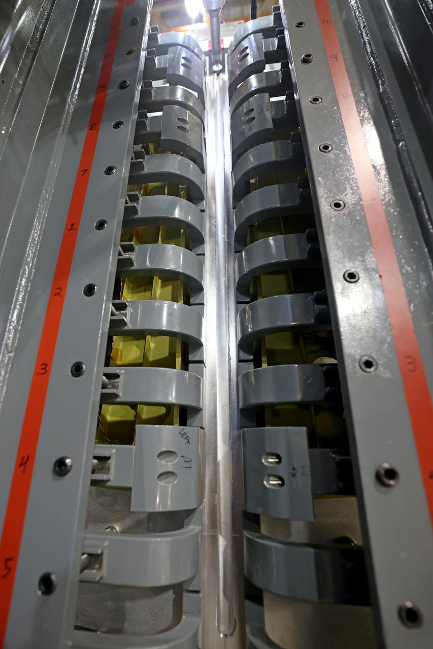 At NASA’s Michoud Assembly Facility in New Orleans, technicians from Orion prime contractor Lockheed Martin have welded together three cone-shaped panels on Orion’s crew module for the Artemis III mission that will land the first woman and next man on the Moon.  The crew module’s primary structure, the pressure vessel, is comprised of seven machined aluminum alloy pieces that are welded together through a weld process that produces a strong, air-tight habitable space for astronauts during the mission. The pressure vessel is designed to withstand the harsh and demanding environment of deep space, and is the core structure upon which all the other elements of Orion’s crew module are integrated.  Infographic showing the seven pieces of Orion's underlying structure  With welding complete on the crew module cone panels – one of which contains windows providing astronauts views of the Moon and Earth – work will begin joining the forward bulkhead to the tunnel to create the top of the spacecraft, followed by the barrel and aft bulkhead join to form the bottom of Orion.  Last, the forward bulkhead will be welded to the top of the panels and, for the seventh and closeout weld, the bottom of the cone panels will be joined to the barrel to complete the pressure vessel. Once welding of the Artemis III crew module primary structure is complete, it will be shipped to NASA’s Kennedy Space Center in Florida where it will undergo further assembly beginning this fall.  Orion, the Space Launch System, and Exploration Ground Systems programs are foundational elements of the Artemis program. Artemis I will be the first integrated flight test of Orion and SLS and is targeted to launch later this year. Artemis II will follow and is the first crewed mission, taking humans farther into space than ever before. Image credit: NASA/Michael DeMocker