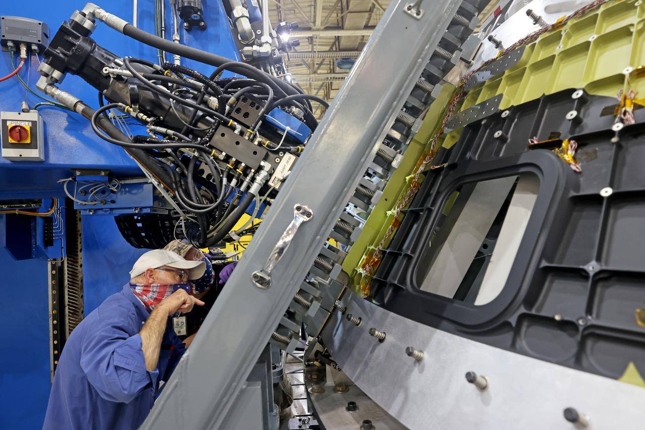 At NASA’s Michoud Assembly Facility in New Orleans, technicians from Orion prime contractor Lockheed Martin have welded together three cone-shaped panels on Orion’s crew module for the Artemis III mission that will land the first woman and next man on the Moon.  The crew module’s primary structure, the pressure vessel, is comprised of seven machined aluminum alloy pieces that are welded together through a weld process that produces a strong, air-tight habitable space for astronauts during the mission. The pressure vessel is designed to withstand the harsh and demanding environment of deep space, and is the core structure upon which all the other elements of Orion’s crew module are integrated.  Infographic showing the seven pieces of Orion's underlying structure  With welding complete on the crew module cone panels – one of which contains windows providing astronauts views of the Moon and Earth – work will begin joining the forward bulkhead to the tunnel to create the top of the spacecraft, followed by the barrel and aft bulkhead join to form the bottom of Orion.  Last, the forward bulkhead will be welded to the top of the panels and, for the seventh and closeout weld, the bottom of the cone panels will be joined to the barrel to complete the pressure vessel. Once welding of the Artemis III crew module primary structure is complete, it will be shipped to NASA’s Kennedy Space Center in Florida where it will undergo further assembly beginning this fall.  Orion, the Space Launch System, and Exploration Ground Systems programs are foundational elements of the Artemis program. Artemis I will be the first integrated flight test of Orion and SLS and is targeted to launch later this year. Artemis II will follow and is the first crewed mission, taking humans farther into space than ever before. Image credit: NASA/Michael DeMocker