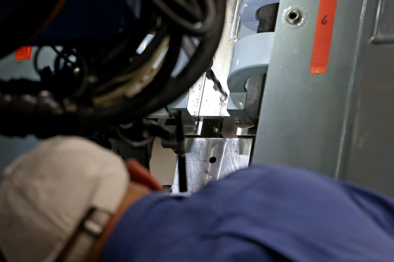 At NASA’s Michoud Assembly Facility in New Orleans, technicians from Orion prime contractor Lockheed Martin have welded together three cone-shaped panels on Orion’s crew module for the Artemis III mission that will land the first woman and next man on the Moon. The crew module’s primary structure, the pressure vessel, is comprised of seven machined aluminum alloy pieces that are welded together through a weld process that produces a strong, air-tight habitable space for astronauts during the mission. The pressure vessel is designed to withstand the harsh and demanding environment of deep space, and is the core structure upon which all the other elements of Orion’s crew module are integrated. Infographic showing the seven pieces of Orion's underlying structure With welding complete on the crew module cone panels – one of which contains windows providing astronauts views of the Moon and Earth – work will begin joining the forward bulkhead to the tunnel to create the top of the spacecraft, followed by the barrel and aft bulkhead join to form the bottom of Orion. Last, the forward bulkhead will be welded to the top of the panels and, for the seventh and closeout weld, the bottom of the cone panels will be joined to the barrel to complete the pressure vessel. Once welding of the Artemis III crew module primary structure is complete, it will be shipped to NASA’s Kennedy Space Center in Florida where it will undergo further assembly beginning this fall. Orion, the Space Launch System, and Exploration Ground Systems programs are foundational elements of the Artemis program. Artemis I will be the first integrated flight test of Orion and SLS and is targeted to launch later this year. Artemis II will follow and is the first crewed mission, taking humans farther into space than ever before. Image credit: NASA/Michael DeMocker