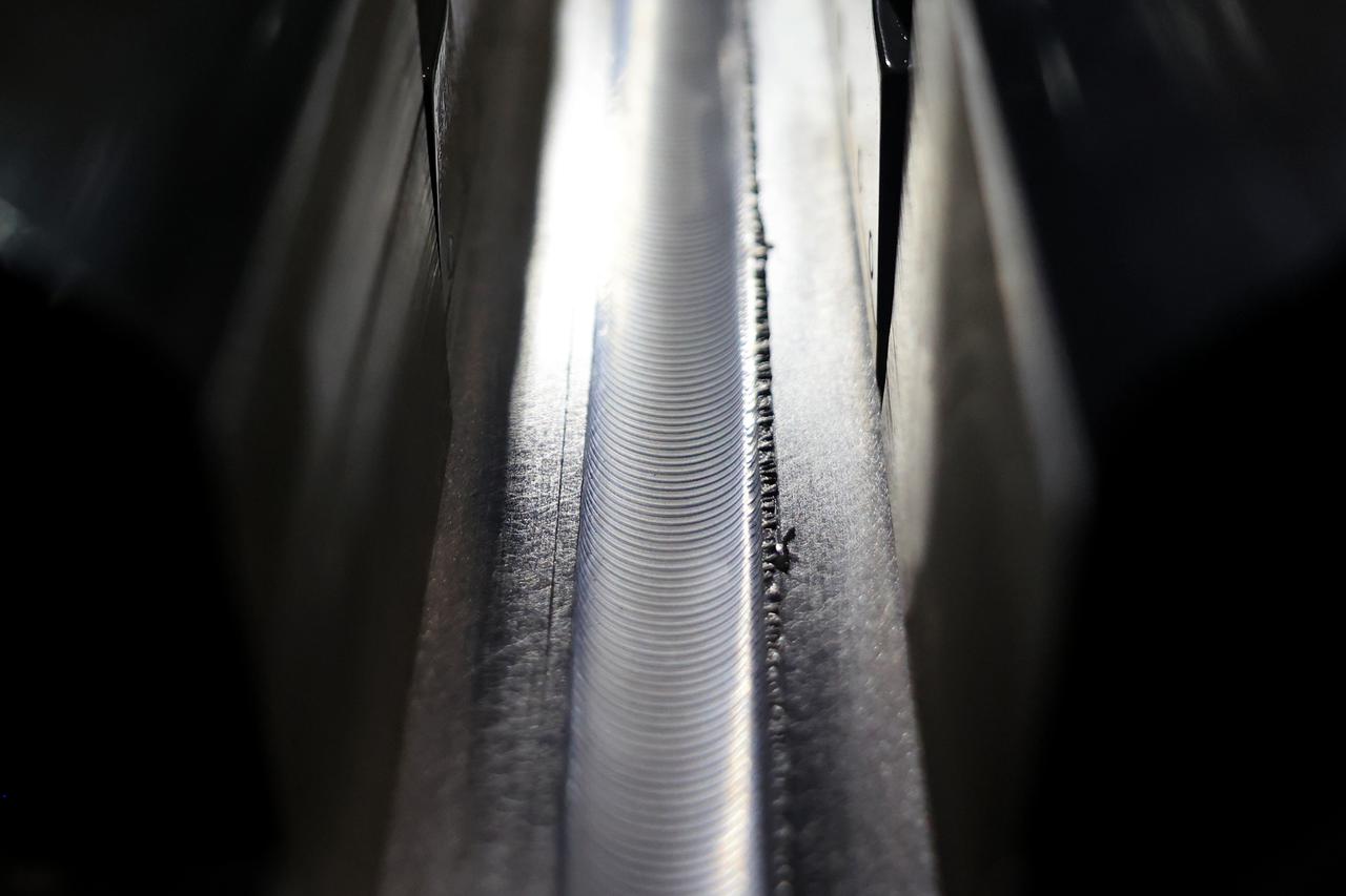 At NASA’s Michoud Assembly Facility in New Orleans, technicians from Orion prime contractor Lockheed Martin have welded together three cone-shaped panels on Orion’s crew module for the Artemis III mission that will land the first woman and next man on the Moon.  The crew module’s primary structure, the pressure vessel, is comprised of seven machined aluminum alloy pieces that are welded together through a weld process that produces a strong, air-tight habitable space for astronauts during the mission. The pressure vessel is designed to withstand the harsh and demanding environment of deep space, and is the core structure upon which all the other elements of Orion’s crew module are integrated.  Infographic showing the seven pieces of Orion's underlying structure  With welding complete on the crew module cone panels – one of which contains windows providing astronauts views of the Moon and Earth – work will begin joining the forward bulkhead to the tunnel to create the top of the spacecraft, followed by the barrel and aft bulkhead join to form the bottom of Orion.  Last, the forward bulkhead will be welded to the top of the panels and, for the seventh and closeout weld, the bottom of the cone panels will be joined to the barrel to complete the pressure vessel. Once welding of the Artemis III crew module primary structure is complete, it will be shipped to NASA’s Kennedy Space Center in Florida where it will undergo further assembly beginning this fall.  Orion, the Space Launch System, and Exploration Ground Systems programs are foundational elements of the Artemis program. Artemis I will be the first integrated flight test of Orion and SLS and is targeted to launch later this year. Artemis II will follow and is the first crewed mission, taking humans farther into space than ever before. Image credit: NASA/Michael DeMocker