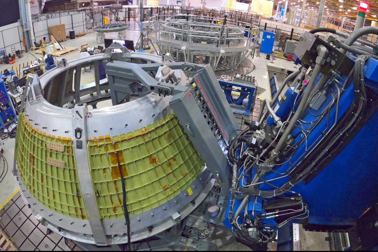 At NASA’s Michoud Assembly Facility in New Orleans, technicians from Orion prime contractor Lockheed Martin have welded together three cone-shaped panels on Orion’s crew module for the Artemis III mission that will land the first woman and next man on the Moon.  The crew module’s primary structure, the pressure vessel, is comprised of seven machined aluminum alloy pieces that are welded together through a weld process that produces a strong, air-tight habitable space for astronauts during the mission. The pressure vessel is designed to withstand the harsh and demanding environment of deep space, and is the core structure upon which all the other elements of Orion’s crew module are integrated.  Infographic showing the seven pieces of Orion's underlying structure  With welding complete on the crew module cone panels – one of which contains windows providing astronauts views of the Moon and Earth – work will begin joining the forward bulkhead to the tunnel to create the top of the spacecraft, followed by the barrel and aft bulkhead join to form the bottom of Orion.  Last, the forward bulkhead will be welded to the top of the panels and, for the seventh and closeout weld, the bottom of the cone panels will be joined to the barrel to complete the pressure vessel. Once welding of the Artemis III crew module primary structure is complete, it will be shipped to NASA’s Kennedy Space Center in Florida where it will undergo further assembly beginning this fall.  Orion, the Space Launch System, and Exploration Ground Systems programs are foundational elements of the Artemis program. Artemis I will be the first integrated flight test of Orion and SLS and is targeted to launch later this year. Artemis II will follow and is the first crewed mission, taking humans farther into space than ever before. Image credit: NASA/Michael DeMocker