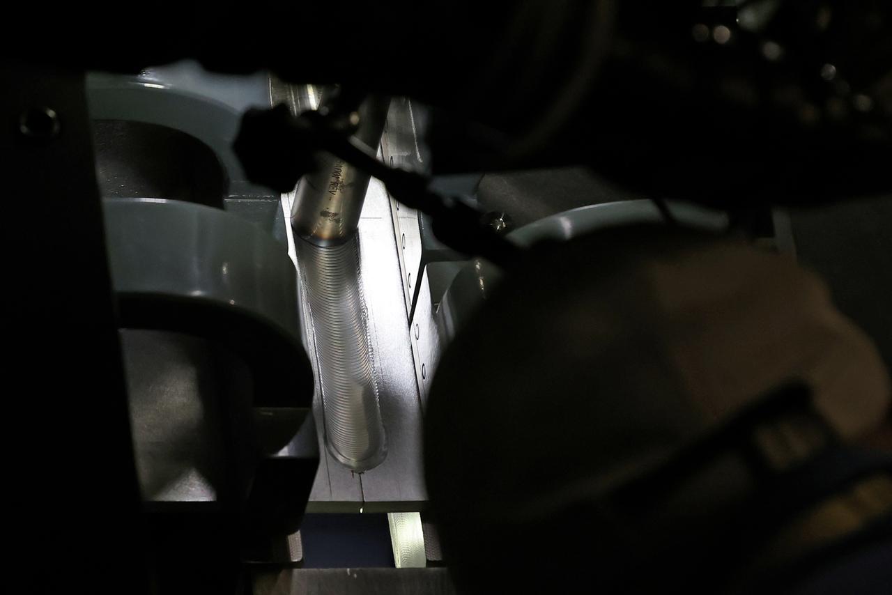 At NASA’s Michoud Assembly Facility in New Orleans, technicians from Orion prime contractor Lockheed Martin have welded together three cone-shaped panels on Orion’s crew module for the Artemis III mission that will land the first woman and next man on the Moon.  The crew module’s primary structure, the pressure vessel, is comprised of seven machined aluminum alloy pieces that are welded together through a weld process that produces a strong, air-tight habitable space for astronauts during the mission. The pressure vessel is designed to withstand the harsh and demanding environment of deep space, and is the core structure upon which all the other elements of Orion’s crew module are integrated.  Infographic showing the seven pieces of Orion's underlying structure  With welding complete on the crew module cone panels – one of which contains windows providing astronauts views of the Moon and Earth – work will begin joining the forward bulkhead to the tunnel to create the top of the spacecraft, followed by the barrel and aft bulkhead join to form the bottom of Orion.  Last, the forward bulkhead will be welded to the top of the panels and, for the seventh and closeout weld, the bottom of the cone panels will be joined to the barrel to complete the pressure vessel. Once welding of the Artemis III crew module primary structure is complete, it will be shipped to NASA’s Kennedy Space Center in Florida where it will undergo further assembly beginning this fall.  Orion, the Space Launch System, and Exploration Ground Systems programs are foundational elements of the Artemis program. Artemis I will be the first integrated flight test of Orion and SLS and is targeted to launch later this year. Artemis II will follow and is the first crewed mission, taking humans farther into space than ever before. Image credit: NASA/Michael DeMocker