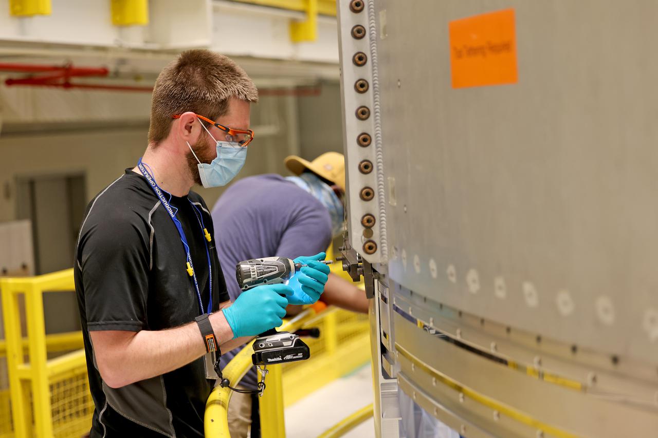 EUS panel test weld at the VXC in Building 115 at the Michoud Assembly Facility on Tuesday, February 9, 2021. Technicians are manufacturing and testing the first in a series of initial weld confidence articles for the Exploration Upper Stage (EUS) for future flights of NASA’s Space Launch System (SLS) rocket at the agency’s Michoud Assembly Facility in New Orleans. The Exploration Upper Stage will be used on the second configuration of the SLS rocket, known as Block 1B, and will provide in-space propulsion to send astronauts in NASA’s Orion spacecraft and heavy cargo on a precise trajectory to the Moon. The Exploration Upper Stage weld confidence panels are first produced in the Vertical Weld Center at Michoud, then small sections of the panels are removed for mechanical testing and analysis in another area of the factory. Teams use weld confidence articles to verify welding procedures, interfaces between the tooling and hardware, and the structural integrity of the welds. Testing of the EUS weld confidence articles will help engineers and technicians validate welding parameters for manufacturing EUS hardware.  The first three SLS flights of NASA’s Artemis program will use an interim cryogenic propulsion stage with one RL10 engine to send Orion to the Moon. The SLS Exploration Upper Stage for flights beyond Artemis III has larger propellant tanks and four RL10 engines. The evolution of the rocket to SLS Block 1B configuration with EUS enables SLS to launch 40% more cargo to the Moon along with the crew. Manufacturing the Exploration Upper Stage is a collaborative effort between NASA and Boeing, the lead contractor for EUS and the SLS core stage.  SLS is the only rocket that can send Orion, astronauts, and supplies to the Moon in a single mission. The SLS rocket, NASA’s Orion spacecraft, Gateway, and human landing system are part of NASA’s backbone for deep space exploration. Under the Artemis program, NASA is working to land the first woman and the next man on the Moon to pave the way for sustainable exploration at the Moon and future missions to Mars. (NASA)