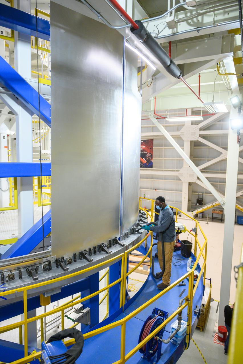 Technicians are manufacturing and testing the first in a series of initial weld confidence articles for the Exploration Upper Stage (EUS) for future flights of NASA’s Space Launch System (SLS) rocket at the agency’s Michoud Assembly Facility in New Orleans. The Exploration Upper Stage will be used on the second configuration of the SLS rocket, known as Block 1B, and will provide in-space propulsion to send astronauts in NASA’s Orion spacecraft and heavy cargo on a precise trajectory to the Moon. The Exploration Upper Stage weld confidence panels are first produced in the Vertical Weld Center at Michoud, then small sections of the panels are removed for mechanical testing and analysis in another area of the factory. Teams use weld confidence articles to verify welding procedures, interfaces between the tooling and hardware, and the structural integrity of the welds. Testing of the EUS weld confidence articles will help engineers and technicians validate welding parameters for manufacturing EUS hardware.  The first three SLS flights of NASA’s Artemis program will use an interim cryogenic propulsion stage with one RL10 engine to send Orion to the Moon. The SLS Exploration Upper Stage for flights beyond Artemis III has larger propellant tanks and four RL10 engines. The evolution of the rocket to SLS Block 1B configuration with EUS enables SLS to launch 40% more cargo to the Moon along with the crew. Manufacturing the Exploration Upper Stage is a collaborative effort between NASA and Boeing, the lead contractor for EUS and the SLS core stage.  SLS is the only rocket that can send Orion, astronauts, and supplies to the Moon in a single mission. The SLS rocket, NASA’s Orion spacecraft, Gateway, and human landing system are part of NASA’s backbone for deep space exploration. Under the Artemis program, NASA is working to land the first woman and the next man on the Moon to pave the way for sustainable exploration at the Moon and future missions to Mars. (NASA)