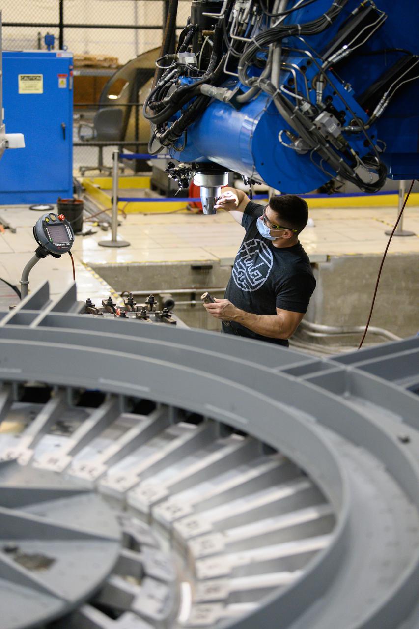Technicians from Orion Prime Contractor Lockheed Martin weld the forward bulkhead of the pressure vessel to the tunnel hardware on the Orion Spacecraft for the Artemis III mission at NASA’s Michoud Assembly Facility in New Orleans. The crew module’s primary structure, the pressure vessel, is comprised of seven machined aluminum alloy pieces that are welded together through a weld process that produces a strong, air-tight habitable space for astronauts during the mission. The pressure vessel is designed to withstand the harsh and demanding environment of deep space and is the core structure upon which all the other elements of Orion’s crew module are integrated.  This pressure vessel weld is the next step following the completion of the crew module cone panel welds and creates the top of the spacecraft. Work will then begin to join the barrel with the aft bulkhead to form the bottom of Orion. Last, the forward bulkhead will be welded to the top of the panels and, for the seventh and closeout weld, the bottom of the cone panels will be joined to the barrel to complete the pressure vessel.  Once welding of the Artemis III crew module primary structure is complete, it will be shipped to NASA’s Kennedy Space Center in Florida where it will undergo further assembly beginning this fall. Orion, the Space Launch System, and Exploration Ground Systems programs are foundational elements of the Artemis program. Artemis I will be the first integrated flight test of Orion and SLS and is targeted to launch later this year. Artemis II will follow and is the first crewed mission, taking humans farther into space than ever before. 