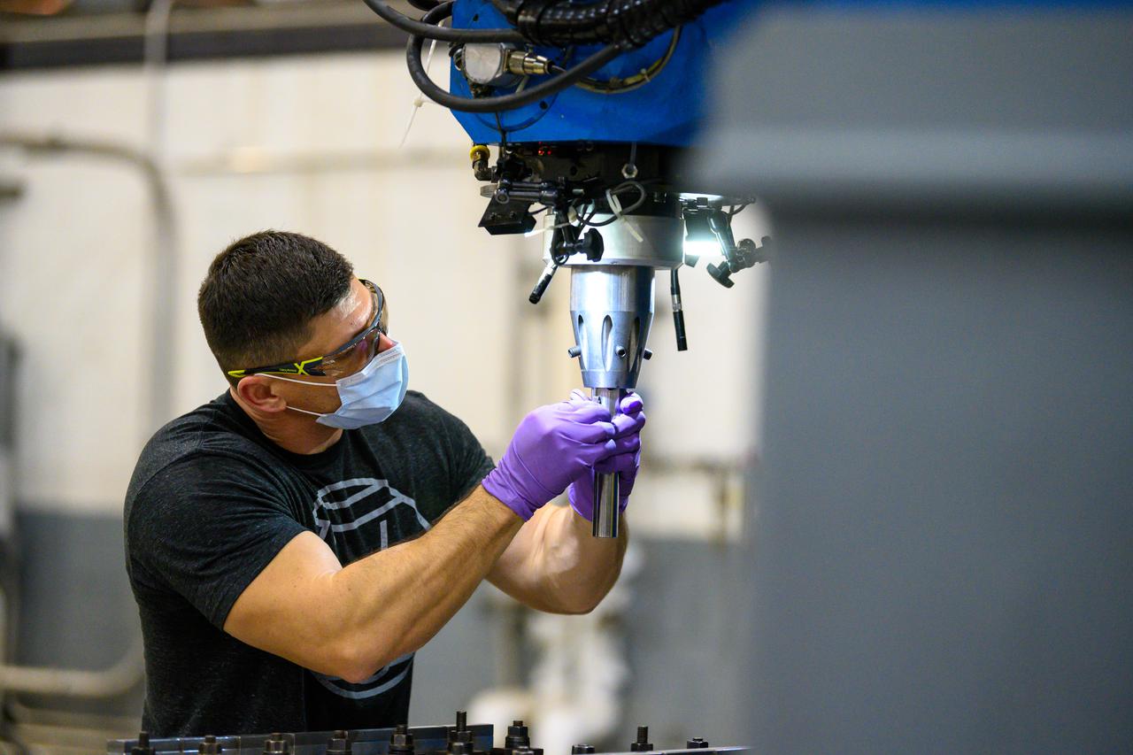 Technicians from Orion Prime Contractor Lockheed Martin weld the forward bulkhead of the pressure vessel to the tunnel hardware on the Orion Spacecraft for the Artemis III mission at NASA’s Michoud Assembly Facility in New Orleans. The crew module’s primary structure, the pressure vessel, is comprised of seven machined aluminum alloy pieces that are welded together through a weld process that produces a strong, air-tight habitable space for astronauts during the mission. The pressure vessel is designed to withstand the harsh and demanding environment of deep space and is the core structure upon which all the other elements of Orion’s crew module are integrated.  This pressure vessel weld is the next step following the completion of the crew module cone panel welds and creates the top of the spacecraft. Work will then begin to join the barrel with the aft bulkhead to form the bottom of Orion. Last, the forward bulkhead will be welded to the top of the panels and, for the seventh and closeout weld, the bottom of the cone panels will be joined to the barrel to complete the pressure vessel.  Once welding of the Artemis III crew module primary structure is complete, it will be shipped to NASA’s Kennedy Space Center in Florida where it will undergo further assembly beginning this fall. Orion, the Space Launch System, and Exploration Ground Systems programs are foundational elements of the Artemis program. Artemis I will be the first integrated flight test of Orion and SLS and is targeted to launch later this year. Artemis II will follow and is the first crewed mission, taking humans farther into space than ever before. 
