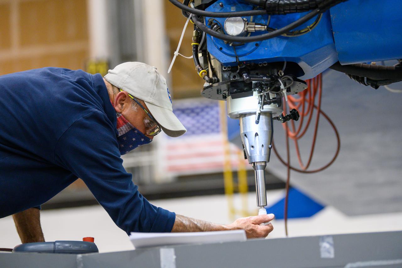 Technicians from Orion Prime Contractor Lockheed Martin weld the forward bulkhead of the pressure vessel to the tunnel hardware on the Orion Spacecraft for the Artemis III mission at NASA’s Michoud Assembly Facility in New Orleans. The crew module’s primary structure, the pressure vessel, is comprised of seven machined aluminum alloy pieces that are welded together through a weld process that produces a strong, air-tight habitable space for astronauts during the mission. The pressure vessel is designed to withstand the harsh and demanding environment of deep space and is the core structure upon which all the other elements of Orion’s crew module are integrated.  This pressure vessel weld is the next step following the completion of the crew module cone panel welds and creates the top of the spacecraft. Work will then begin to join the barrel with the aft bulkhead to form the bottom of Orion. Last, the forward bulkhead will be welded to the top of the panels and, for the seventh and closeout weld, the bottom of the cone panels will be joined to the barrel to complete the pressure vessel.  Once welding of the Artemis III crew module primary structure is complete, it will be shipped to NASA’s Kennedy Space Center in Florida where it will undergo further assembly beginning this fall. Orion, the Space Launch System, and Exploration Ground Systems programs are foundational elements of the Artemis program. Artemis I will be the first integrated flight test of Orion and SLS and is targeted to launch later this year. Artemis II will follow and is the first crewed mission, taking humans farther into space than ever before. 