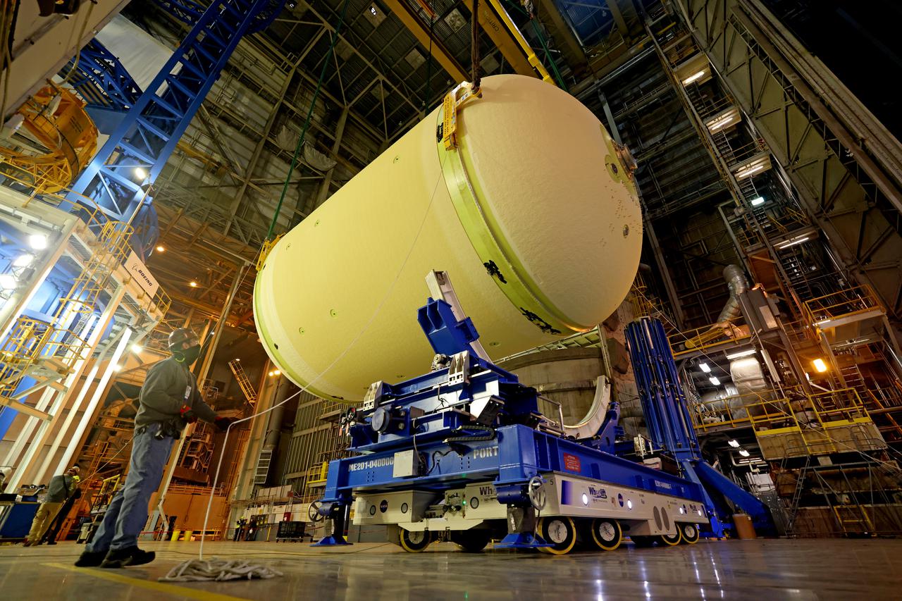This image highlights the liquid oxygen tank, which will be used on the core stage of NASA’ Space Launch System rocket for Artemis II, the first crewed mission of NASA’s Artemis program, at NASA’s Michoud Assembly Facility. The SLS core stage is made up of five unique elements: the forward skirt, liquid oxygen tank, intertank, liquid hydrogen tank, and the engine section. The forward skirt houses flight computers, cameras, and avionics systems. The liquid oxygen tank holds 196,000 gallons of liquid oxygen cooled to minus 297 degrees Fahrenheit. The LOX hardware sits between the core stage’s forward skirt and the intertank. Along with the liquid hydrogen tank, it will provide fuel to the four RS-25 engines at the bottom of the core stage to produce more than two million pounds of thrust to launch NASA’s Artemis missions to the Moon. Together with its four RS-25 engines, the rocket’s massive 212-foot-tall core stage — the largest stage NASA has ever built — and its twin solid rocket boosters will produce 8.8 million pounds of thrust to send NASA’s Orion spacecraft, astronauts and supplies beyond Earth’s orbit to the Moon and, ultimately, Mars. Offering more payload mass, volume capability and energy to speed missions through space, the SLS rocket, along with NASA’s Gateway in lunar orbit, the Human Landing System, and Orion spacecraft, is part of NASA’s backbone for deep space exploration and the Artemis lunar program. No other rocket can send astronauts in Orion around the Moon in a single mission. Image credit: NASA/Michael DeMocker