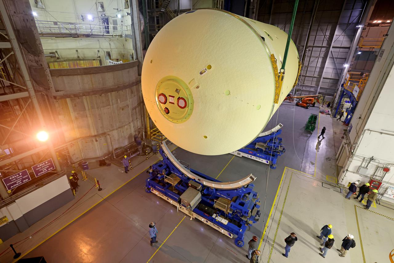 This image highlights the liquid oxygen tank, which will be used on the core stage of NASA’ Space Launch System rocket for Artemis II, the first crewed mission of NASA’s Artemis program, at NASA’s Michoud Assembly Facility. The SLS core stage is made up of five unique elements: the forward skirt, liquid oxygen tank, intertank, liquid hydrogen tank, and the engine section. The forward skirt houses flight computers, cameras, and avionics systems. The liquid oxygen tank holds 196,000 gallons of liquid oxygen cooled to minus 297 degrees Fahrenheit. The LOX hardware sits between the core stage’s forward skirt and the intertank. Along with the liquid hydrogen tank, it will provide fuel to the four RS-25 engines at the bottom of the core stage to produce more than two million pounds of thrust to launch NASA’s Artemis missions to the Moon.     Together with its four RS-25 engines, the rocket’s massive 212-foot-tall core stage — the largest stage NASA has ever built — and its twin solid rocket boosters will produce 8.8 million pounds of thrust to send NASA’s Orion spacecraft, astronauts and supplies beyond Earth’s orbit to the Moon and, ultimately, Mars. Offering more payload mass, volume capability and energy to speed missions through space, the SLS rocket, along with NASA’s Gateway in lunar orbit, the Human Landing System, and Orion spacecraft, is part of NASA’s backbone for deep space exploration and the Artemis lunar program. No other rocket can send astronauts in Orion around the Moon in a single mission. Image credit: NASA/Michael DeMocker 