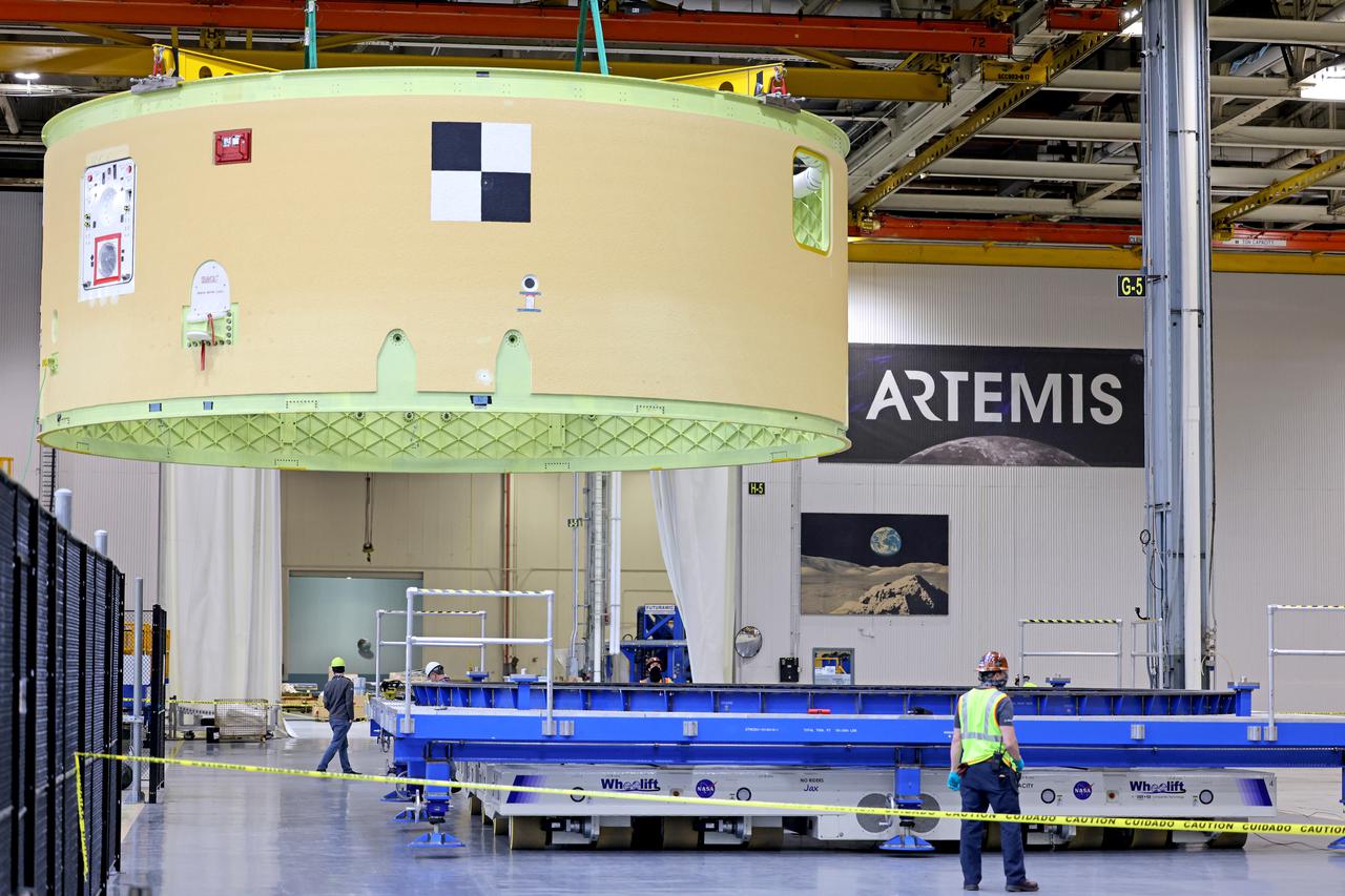 This image shows the forward skirt that will be used on the core stage of NASA’s Space Launch System rocket for Artemis II, the first crewed mission of NASA’s Artemis program, at NASA’s Michoud Assembly Facility. The SLS core stage is made up of five unique elements: the forward skirt, liquid oxygen tank, intertank, liquid hydrogen tank, and the engine section. The forward skirt houses flight computers, cameras, and avionics systems. The hardware is located at the top of the 212-foot-tall core stage and connects the upper part of the rocket to the core stage. Soon, technicians will ready the forward skirt for the first of three core stage assembly mates called the forward join. The forward join consists of three main parts -- the forward skirt, liquid oxygen tank, and intertank – to create the top, or forward part, of the core stage.  Together with its four RS-25 engines, the rocket’s massive 212-foot-tall core stage — the largest stage NASA has ever built — and its twin solid rocket boosters will produce 8.8 million pounds of thrust to send NASA’s Orion spacecraft, astronauts and supplies beyond Earth’s orbit to the Moon and, ultimately, Mars. Offering more payload mass, volume capability and energy to speed missions through space, the SLS rocket, along with NASA’s Gateway in lunar orbit, the human landing system, and Orion spacecraft, is part of NASA’s backbone for deep space exploration and the Artemis lunar program. No other rocket is capable of carrying astronauts in Orion around the Moon in a single mission. Image credit: NASA/Michael DeMocker 