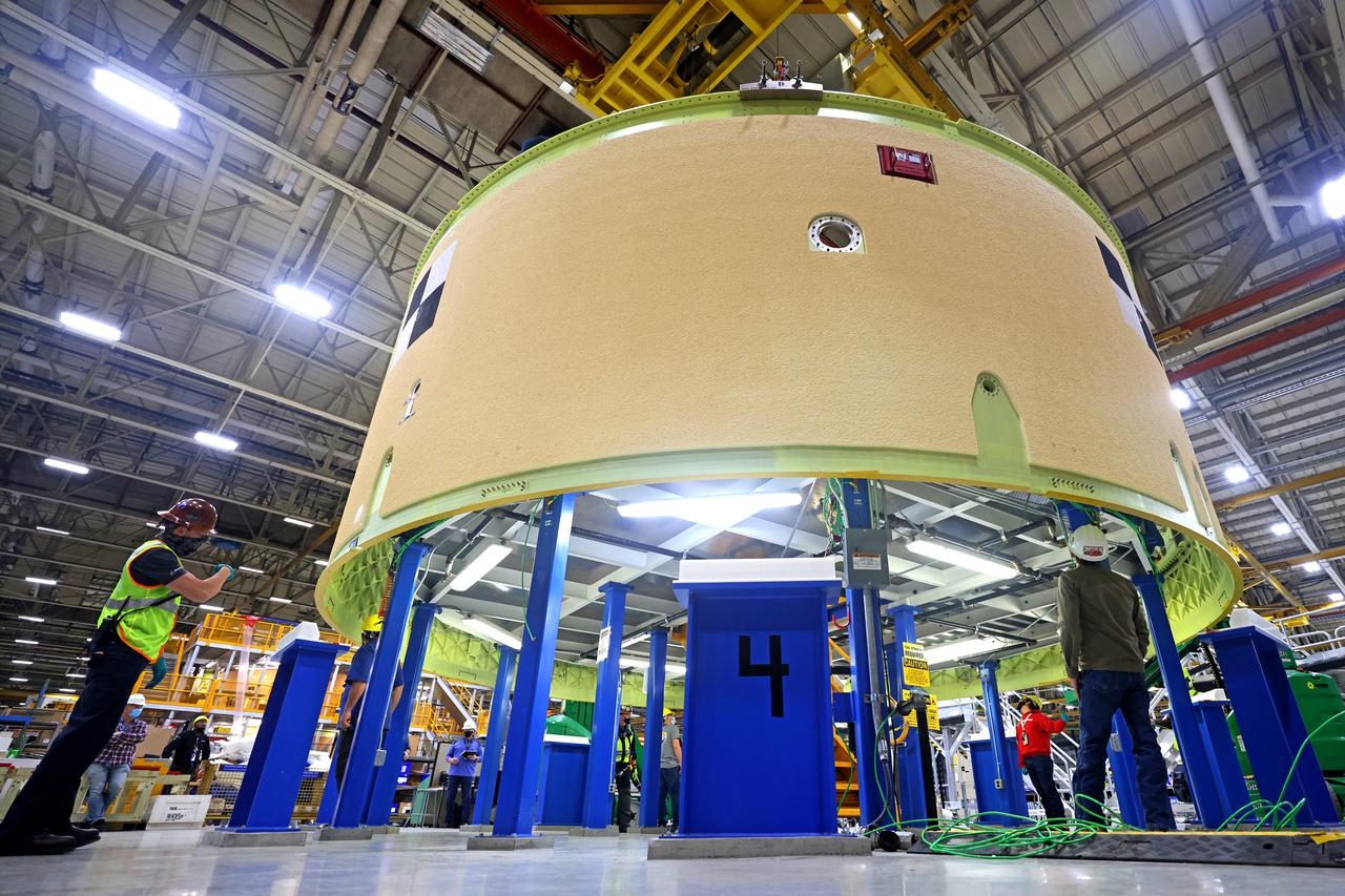 This image shows the forward skirt that will be used on the core stage of NASA’s Space Launch System rocket for Artemis II, the first crewed mission of NASA’s Artemis program, at NASA’s Michoud Assembly Facility. The SLS core stage is made up of five unique elements: the forward skirt, liquid oxygen tank, intertank, liquid hydrogen tank, and the engine section. The forward skirt houses flight computers, cameras, and avionics systems. The hardware is located at the top of the 212-foot-tall core stage and connects the upper part of the rocket to the core stage. Soon, technicians will ready the forward skirt for the first of three core stage assembly mates called the forward join. The forward join consists of three main parts -- the forward skirt, liquid oxygen tank, and intertank – to create the top, or forward part, of the core stage.  Together with its four RS-25 engines, the rocket’s massive 212-foot-tall core stage — the largest stage NASA has ever built — and its twin solid rocket boosters will produce 8.8 million pounds of thrust to send NASA’s Orion spacecraft, astronauts and supplies beyond Earth’s orbit to the Moon and, ultimately, Mars. Offering more payload mass, volume capability and energy to speed missions through space, the SLS rocket, along with NASA’s Gateway in lunar orbit, the human landing system, and Orion spacecraft, is part of NASA’s backbone for deep space exploration and the Artemis lunar program. No other rocket is capable of carrying astronauts in Orion around the Moon in a single mission. Image credit: NASA/Michael DeMocker 