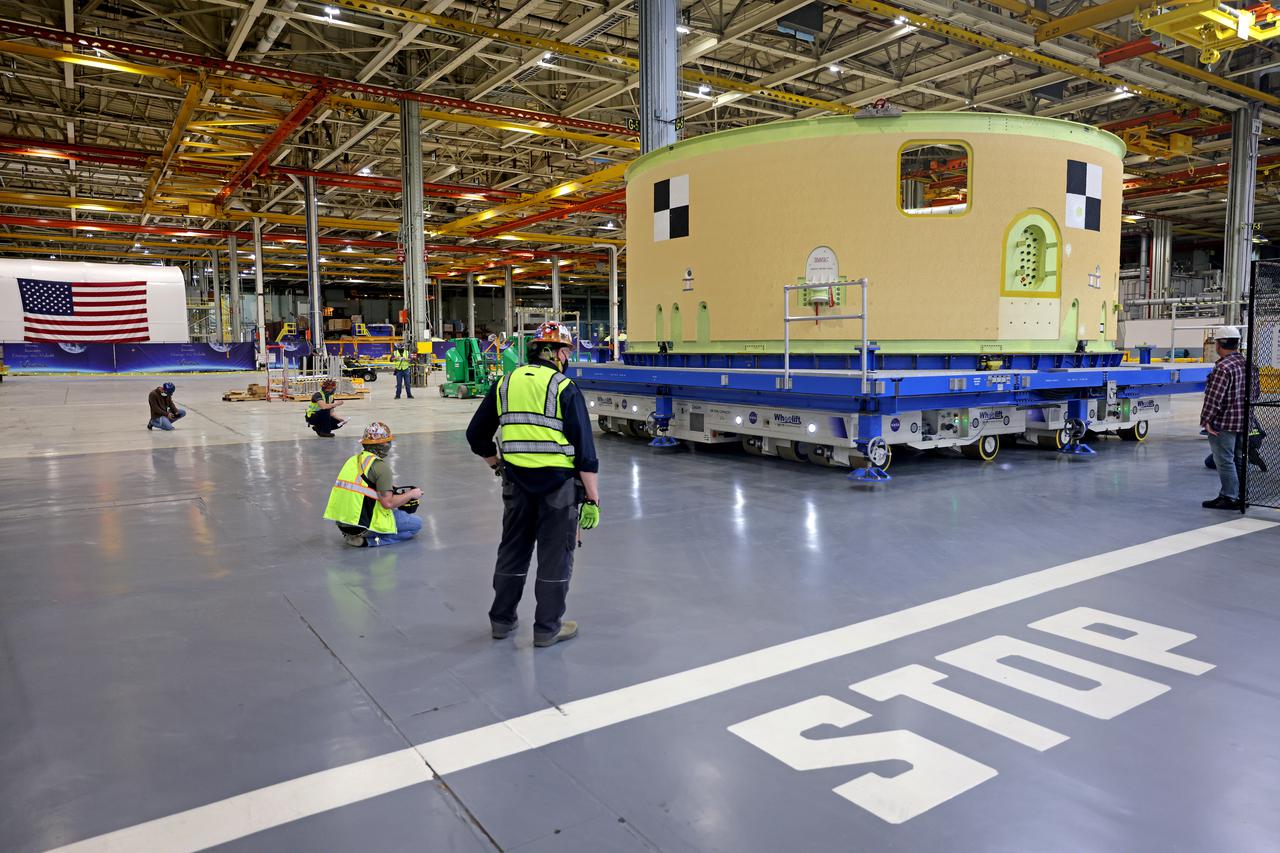 This image shows the forward skirt that will be used on the core stage of NASA’s Space Launch System rocket for Artemis II, the first crewed mission of NASA’s Artemis program, at NASA’s Michoud Assembly Facility. The SLS core stage is made up of five unique elements: the forward skirt, liquid oxygen tank, intertank, liquid hydrogen tank, and the engine section. The forward skirt houses flight computers, cameras, and avionics systems. The hardware is located at the top of the 212-foot-tall core stage and connects the upper part of the rocket to the core stage. Soon, technicians will ready the forward skirt for the first of three core stage assembly mates called the forward join. The forward join consists of three main parts -- the forward skirt, liquid oxygen tank, and intertank – to create the top, or forward part, of the core stage.  Together with its four RS-25 engines, the rocket’s massive 212-foot-tall core stage — the largest stage NASA has ever built — and its twin solid rocket boosters will produce 8.8 million pounds of thrust to send NASA’s Orion spacecraft, astronauts and supplies beyond Earth’s orbit to the Moon and, ultimately, Mars. Offering more payload mass, volume capability and energy to speed missions through space, the SLS rocket, along with NASA’s Gateway in lunar orbit, the human landing system, and Orion spacecraft, is part of NASA’s backbone for deep space exploration and the Artemis lunar program. No other rocket is capable of carrying astronauts in Orion around the Moon in a single mission. Image credit: NASA/Michael DeMocker 