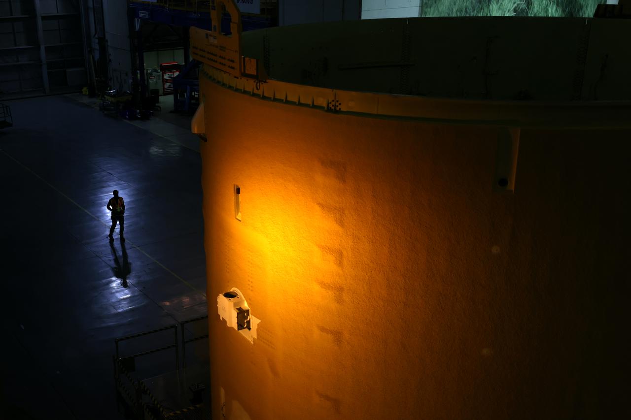 This image shows technicians and engineers beginning the process of the forward join on the core stage of NASA’s Space Launch System rocket for Artemis II, the first crewed mission of NASA’s Artemis program at NASA’s Michoud Assembly Facility. The forward join connects the forward skirt, the liquid oxygen tank (LOX) and the intertank structures to form the top part of the SLS rocket’s core stage. Now, NASA and Boeing, the SLS prime contractor, will continue to integrate various systems inside the forward part of the core stage and prepare for structural joining of the liquid hydrogen tank and engine section to form the bottom of the stage.  Together with its four RS-25 engines, the rocket’s massive 212-foot-tall core stage — the largest stage NASA has ever built — and its twin solid rocket boosters will produce 8.8 million pounds of thrust to send NASA’s Orion spacecraft, astronauts and supplies beyond Earth’s orbit to the Moon and, ultimately, Mars. Offering more payload mass, volume capability and energy to speed missions through space, the SLS rocket, along with NASA’s Gateway in lunar orbit, the Human Landing System, and Orion spacecraft, is part of NASA’s backbone for deep space exploration and the Artemis lunar program. No other rocket is capable of carrying astronauts in Orion around the Moon in a single mission. Image credit: NASA/Michael DeMocker 