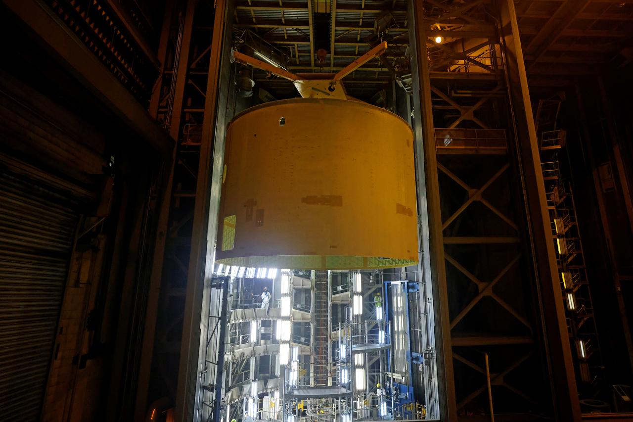 Technicians at NASA’s Michoud Assembly Facility prime and move the engine section of NASA’s Space Launch System rocket for Artemis III in preparation for its next step in production. This hardware is the first large piece manufactured for the Artemis III mission and makes up the lowest portion of the 212-foot-tall core stage. When complete, the engine section will house the four RS-25 engines and include vital systems for mounting, controlling and delivering fuel from the propellant tanks to the rocket’s engines.   Together with its four RS-25 engines and its twin solid rocket boosters, it will produce 8.8 million pounds of thrust to send NASA’s Orion spacecraft, astronauts, and supplies beyond Earth’s orbit to the Moon and, ultimately, Mars. Offering more payload mass, volume capability, and energy to speed missions through space, the SLS rocket, along with NASA’s Gateway in lunar orbit, the Human Landing System, and Orion spacecraft, is part of NASA’s backbone for deep space exploration and the Artemis lunar program. No other rocket is capable of carrying astronauts in Orion around the Moon in a single mission. 