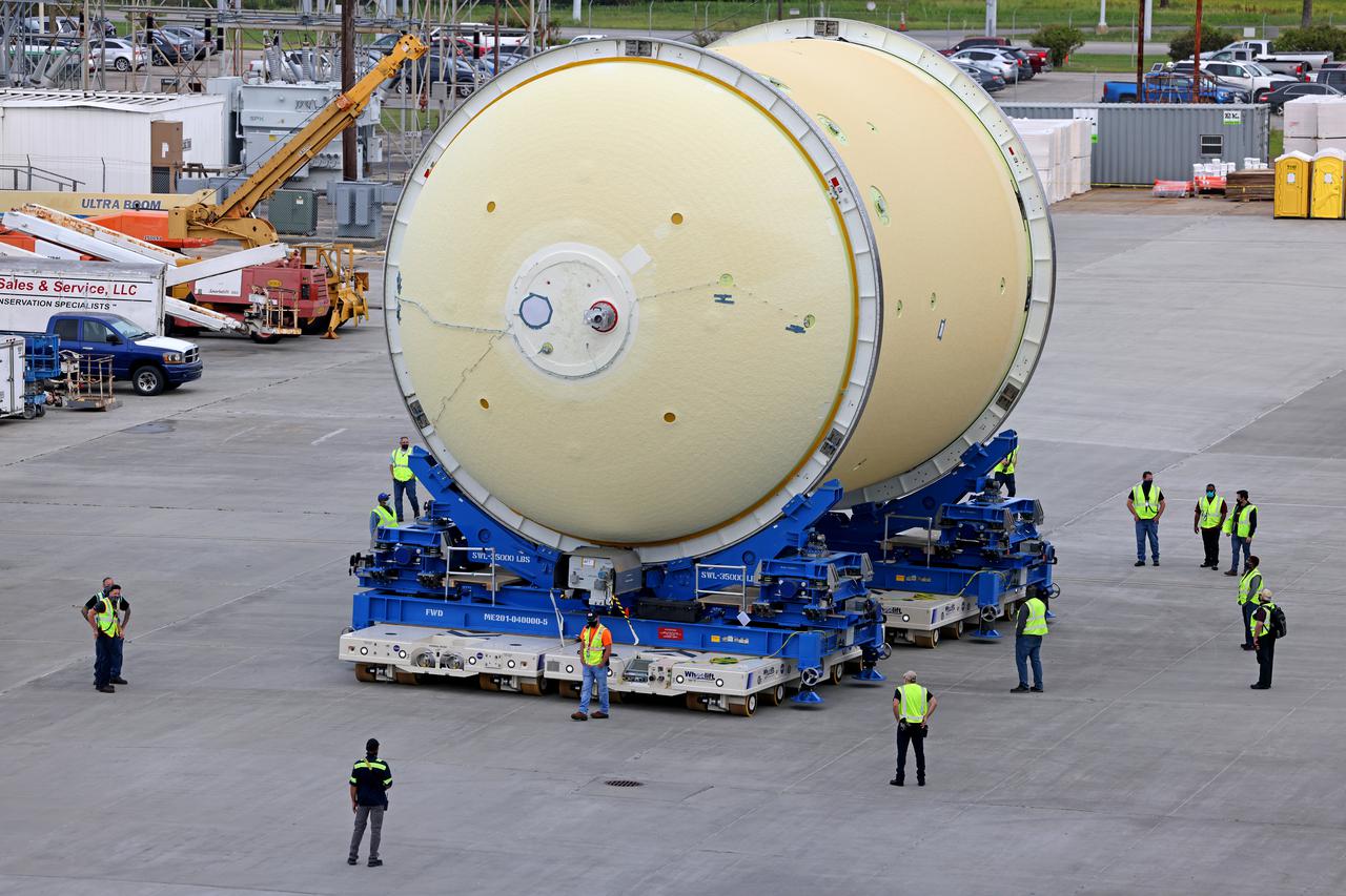 This image shows technicians and engineers moving the liquid oxygen tank (LOX) into position as they continue the process of the forward join on the core stage of NASA’s Space Launch System rocket for Artemis II, the first crewed mission of NASA’s Artemis program at NASA’s Michoud Assembly Facility. The forward join connects the forward skirt, the liquid oxygen tank (LOX) and the intertank structures to form the top part of the SLS rocket’s core stage. Now, NASA and Boeing, the SLS prime contractor, will continue to integrate various systems inside the forward part of the core stage and prepare for structural joining of the liquid hydrogen tank and engine section to form the bottom of the stage.  Together with its four RS-25 engines, the rocket’s massive 212-foot-tall core stage — the largest stage NASA has ever built — and its twin solid rocket boosters will produce 8.8 million pounds of thrust to send NASA’s Orion spacecraft, astronauts and supplies beyond Earth’s orbit to the Moon and, ultimately, Mars. Offering more payload mass, volume capability and energy to speed missions through space, the SLS rocket, along with NASA’s Gateway in lunar orbit, the Human Landing System, and Orion spacecraft, is part of NASA’s backbone for deep space exploration and the Artemis lunar program. No other rocket is capable of carrying astronauts in Orion around the Moon in a single mission. Image credit: NASA/Michael DeMocker 