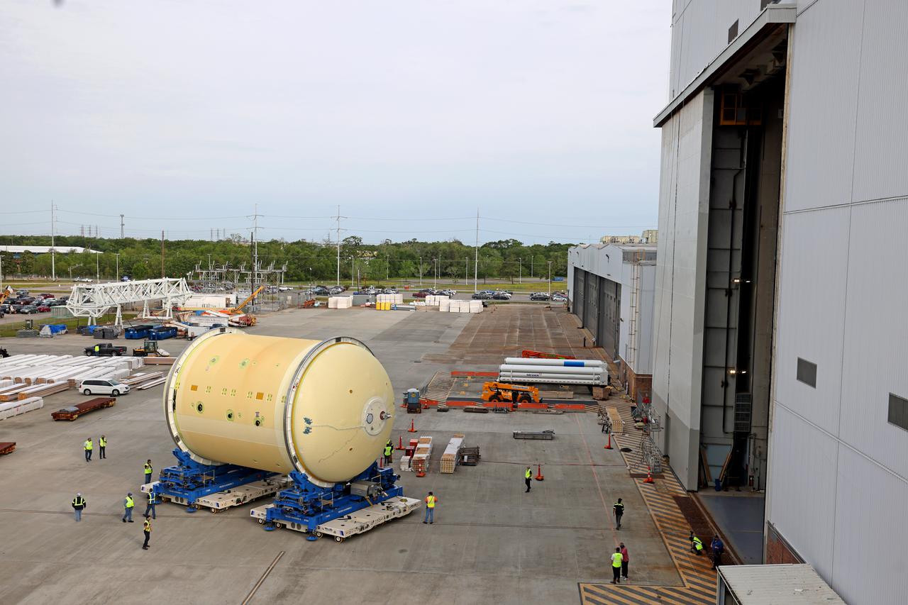 This image shows technicians and engineers moving the liquid oxygen tank (LOX) into position as they continue the process of the forward join on the core stage of NASA’s Space Launch System rocket for Artemis II, the first crewed mission of NASA’s Artemis program at NASA’s Michoud Assembly Facility. The forward join connects the forward skirt, the liquid oxygen tank (LOX) and the intertank structures to form the top part of the SLS rocket’s core stage. Now, NASA and Boeing, the SLS prime contractor, will continue to integrate various systems inside the forward part of the core stage and prepare for structural joining of the liquid hydrogen tank and engine section to form the bottom of the stage.  Together with its four RS-25 engines, the rocket’s massive 212-foot-tall core stage — the largest stage NASA has ever built — and its twin solid rocket boosters will produce 8.8 million pounds of thrust to send NASA’s Orion spacecraft, astronauts and supplies beyond Earth’s orbit to the Moon and, ultimately, Mars. Offering more payload mass, volume capability and energy to speed missions through space, the SLS rocket, along with NASA’s Gateway in lunar orbit, the Human Landing System, and Orion spacecraft, is part of NASA’s backbone for deep space exploration and the Artemis lunar program. No other rocket is capable of carrying astronauts in Orion around the Moon in a single mission. Image credit: NASA/Michael DeMocker 
