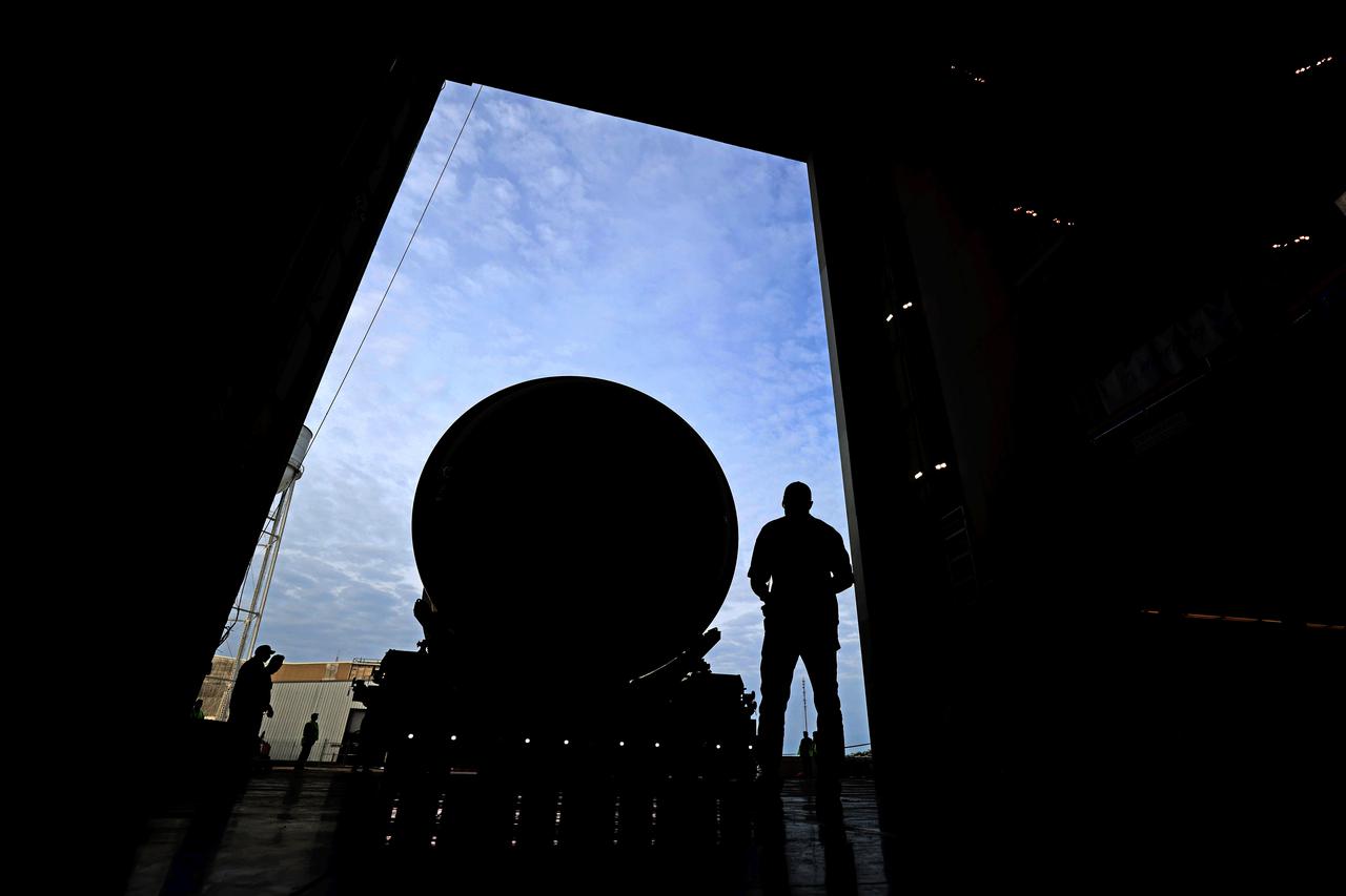 This image shows technicians and engineers moving the liquid oxygen tank (LOX) into position as they continue the process of the forward join on the core stage of NASA’s Space Launch System rocket for Artemis II, the first crewed mission of NASA’s Artemis program at NASA’s Michoud Assembly Facility. The forward join connects the forward skirt, the liquid oxygen tank (LOX) and the intertank structures to form the top part of the SLS rocket’s core stage. Now, NASA and Boeing, the SLS prime contractor, will continue to integrate various systems inside the forward part of the core stage and prepare for structural joining of the liquid hydrogen tank and engine section to form the bottom of the stage.  Together with its four RS-25 engines, the rocket’s massive 212-foot-tall core stage — the largest stage NASA has ever built — and its twin solid rocket boosters will produce 8.8 million pounds of thrust to send NASA’s Orion spacecraft, astronauts and supplies beyond Earth’s orbit to the Moon and, ultimately, Mars. Offering more payload mass, volume capability and energy to speed missions through space, the SLS rocket, along with NASA’s Gateway in lunar orbit, the Human Landing System, and Orion spacecraft, is part of NASA’s backbone for deep space exploration and the Artemis lunar program. No other rocket is capable of carrying astronauts in Orion around the Moon in a single mission. Image credit: NASA/Michael DeMocker 