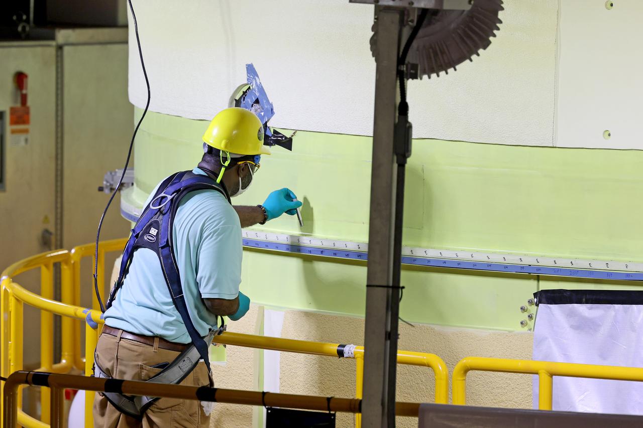 This image shows technicians and engineers move and connect the liquid oxygen tank (LOX) to the intertank as they continue the process of the forward join on the core stage of NASA’s Space Launch System rocket for Artemis II, the first crewed mission of NASA’s Artemis program at NASA’s Michoud Assembly Facility. The forward join connects the forward skirt, the liquid oxygen tank (LOX) and the intertank structures to form the top part of the SLS rocket’s core stage. Now, NASA and Boeing, the SLS prime contractor, will continue to integrate various systems inside the forward part of the core stage and prepare for structural joining of the liquid hydrogen tank and engine section to form the bottom of the stage.  Together with its four RS-25 engines, the rocket’s massive 212-foot-tall core stage — the largest stage NASA has ever built — and its twin solid rocket boosters will produce 8.8 million pounds of thrust to send NASA’s Orion spacecraft, astronauts and supplies beyond Earth’s orbit to the Moon and, ultimately, Mars. Offering more payload mass, volume capability and energy to speed missions through space, the SLS rocket, along with NASA’s Gateway in lunar orbit, the Human Landing System, and Orion spacecraft, is part of NASA’s backbone for deep space exploration and the Artemis lunar program. No other rocket is capable of carrying astronauts in Orion around the Moon in a single mission. Image credit: NASA/Michael DeMocker 