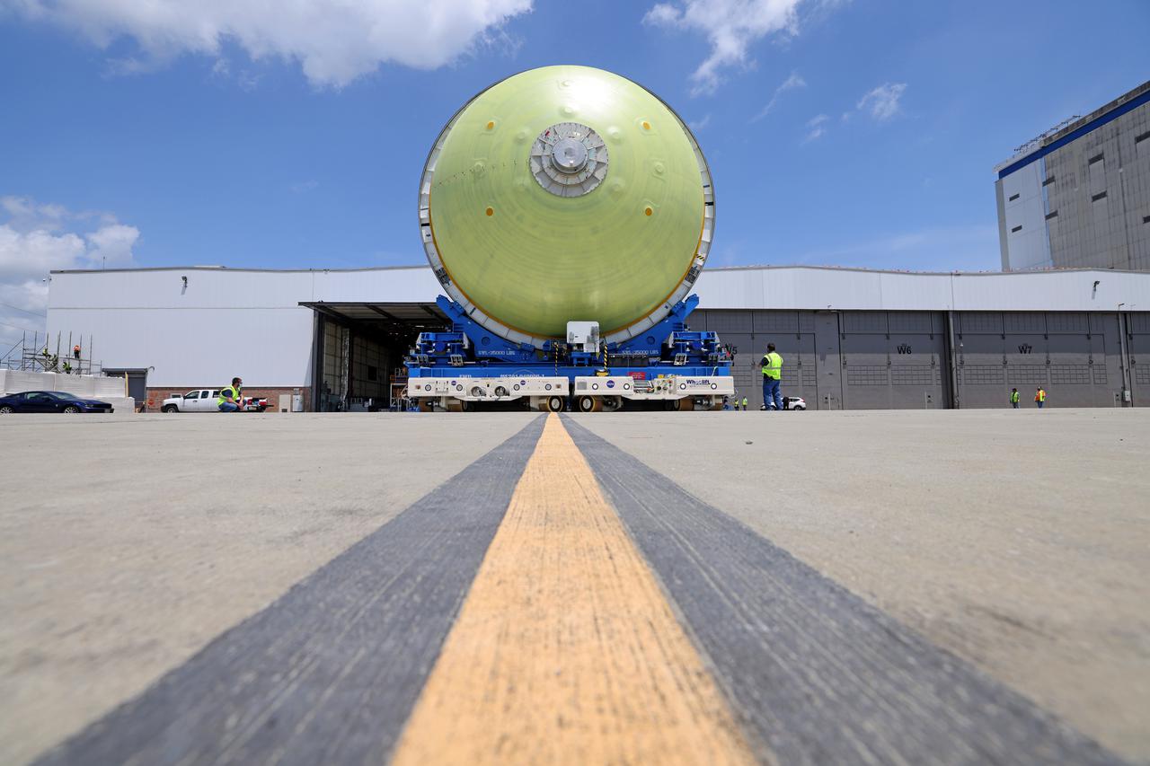 This image highlights the liquid hydrogen tank that will be used on the core stage of NASA’s Space Launch System rocket for Artemis II, the first crewed mission of NASA’s Artemis program. The tank is being built at NASA’s Michoud Assembly Facility in New Orleans. The SLS core stage is made up of five unique elements: the forward skirt, liquid oxygen tank, intertank, liquid hydrogen tank, and the engine section. The liquid hydrogen tank holds 537,000 gallons of liquid hydrogen cooled to minus 423 degrees Fahrenheit and sits between the core stage’s intertank and engine section. The liquid hydrogen hardware, along with the liquid oxygen tank, will provide propellant to the four RS-25 engines at the bottom of the cores stage to produce more than two million pounds of thrust to launch NASA’s Artemis missions to the Moon. Together with its four RS-25 engines, the rocket’s massive 212-foot-tall core stage — the largest stage NASA has ever built — and its twin solid rocket boosters will produce 8.8 million pounds of thrust to send NASA’s Orion spacecraft, astronauts and supplies beyond Earth’s orbit to the Moon and, ultimately, Mars. Offering more payload mass, volume capability and energy to speed missions through space, the SLS rocket, along with NASA’s Gateway in lunar orbit, the human landing system, and Orion spacecraft, is part of NASA’s backbone for deep space exploration and the Artemis lunar program. No other rocket can send astronauts in Orion around the Moon in a single mission. Image credit: NASA/Michael DeMocker
