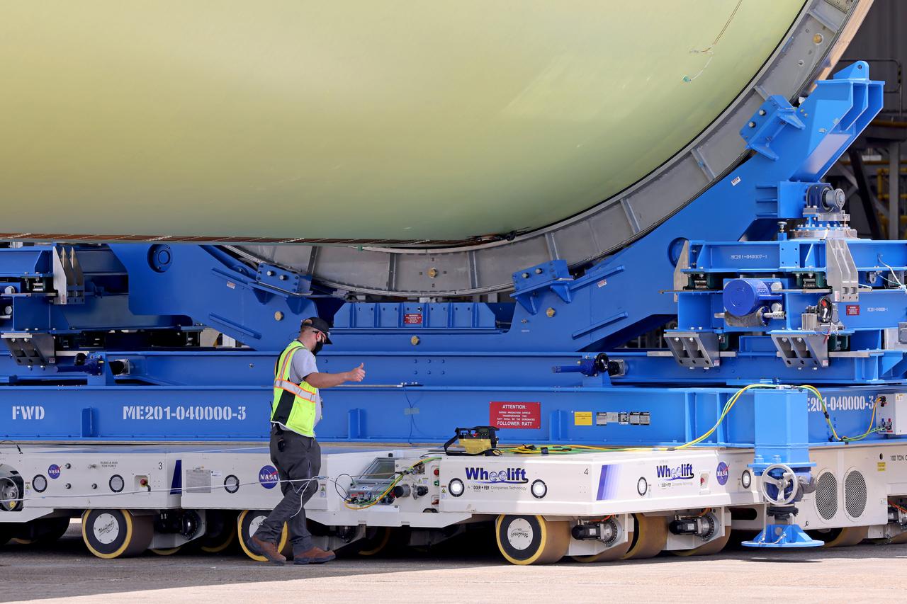 This image highlights the liquid hydrogen tank that will be used on the core stage of NASA’s Space Launch System rocket for Artemis II, the first crewed mission of NASA’s Artemis program. The tank is being built at NASA’s Michoud Assembly Facility in New Orleans. The SLS core stage is made up of five unique elements: the forward skirt, liquid oxygen tank, intertank, liquid hydrogen tank, and the engine section. The liquid hydrogen tank holds 537,000 gallons of liquid hydrogen cooled to minus 423 degrees Fahrenheit and sits between the core stage’s intertank and engine section. The liquid hydrogen hardware, along with the liquid oxygen tank, will provide propellant to the four RS-25 engines at the bottom of the cores stage to produce more than two million pounds of thrust to launch NASA’s Artemis missions to the Moon. Together with its four RS-25 engines, the rocket’s massive 212-foot-tall core stage — the largest stage NASA has ever built — and its twin solid rocket boosters will produce 8.8 million pounds of thrust to send NASA’s Orion spacecraft, astronauts and supplies beyond Earth’s orbit to the Moon and, ultimately, Mars. Offering more payload mass, volume capability and energy to speed missions through space, the SLS rocket, along with NASA’s Gateway in lunar orbit, the human landing system, and Orion spacecraft, is part of NASA’s backbone for deep space exploration and the Artemis lunar program. No other rocket can send astronauts in Orion around the Moon in a single mission. Image credit: NASA/Michael DeMocker