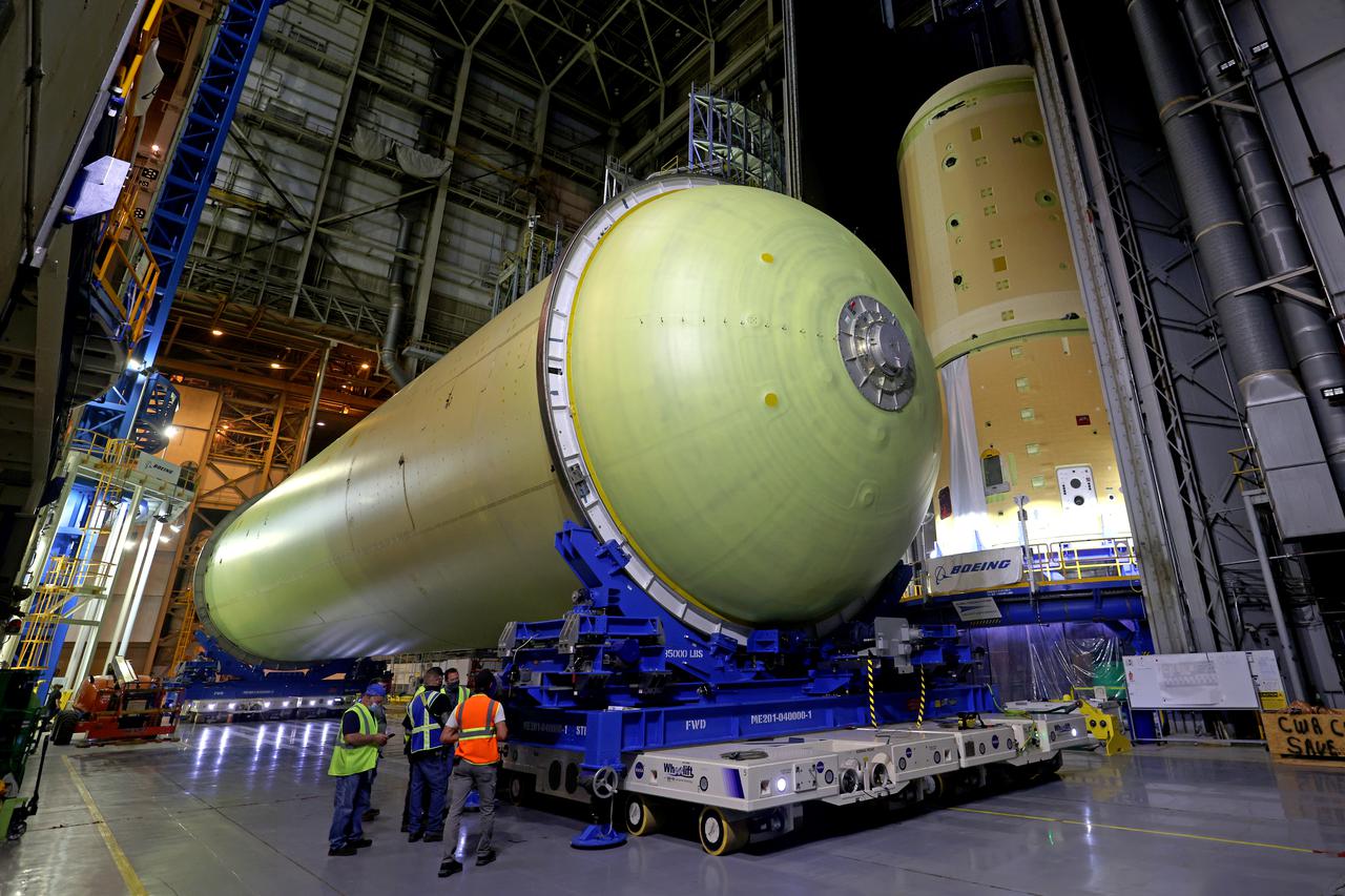 This image highlights the liquid hydrogen tank that will be used on the core stage of NASA’s Space Launch System rocket for Artemis II, the first crewed mission of NASA’s Artemis program. The tank is being built at NASA’s Michoud Assembly Facility in New Orleans. The SLS core stage is made up of five unique elements: the forward skirt, liquid oxygen tank, intertank, liquid hydrogen tank, and the engine section. The liquid hydrogen tank holds 537,000 gallons of liquid hydrogen cooled to minus 423 degrees Fahrenheit and sits between the core stage’s intertank and engine section. The liquid hydrogen hardware, along with the liquid oxygen tank, will provide propellant to the four RS-25 engines at the bottom of the cores stage to produce more than two million pounds of thrust to launch NASA’s Artemis missions to the Moon. Together with its four RS-25 engines, the rocket’s massive 212-foot-tall core stage — the largest stage NASA has ever built — and its twin solid rocket boosters will produce 8.8 million pounds of thrust to send NASA’s Orion spacecraft, astronauts and supplies beyond Earth’s orbit to the Moon and, ultimately, Mars. Offering more payload mass, volume capability and energy to speed missions through space, the SLS rocket, along with NASA’s Gateway in lunar orbit, the human landing system, and Orion spacecraft, is part of NASA’s backbone for deep space exploration and the Artemis lunar program. No other rocket can send astronauts in Orion around the Moon in a single mission. Image credit: NASA/Michael DeMocker