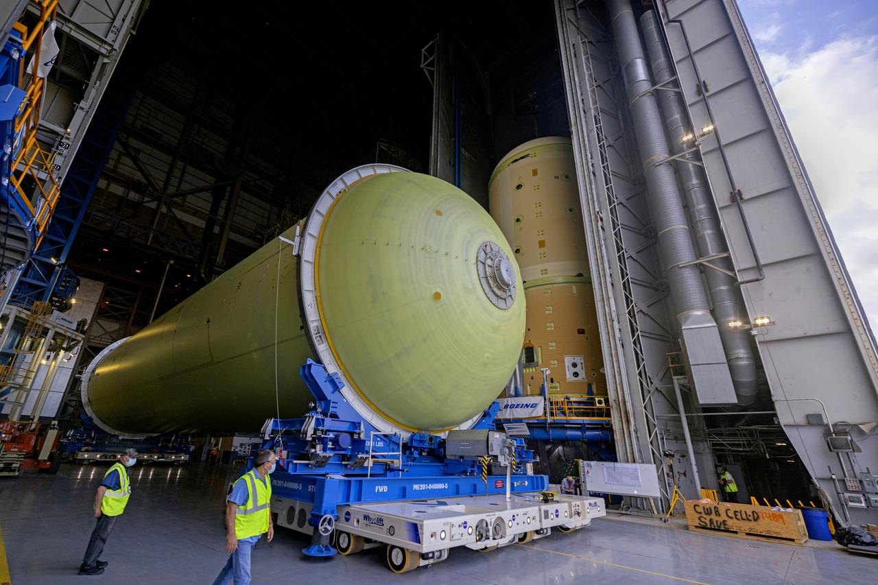 This image highlights the liquid hydrogen tank that will be used on the core stage of NASA’s Space Launch System rocket for Artemis II, the first crewed mission of NASA’s Artemis program. The tank is being built at NASA’s Michoud Assembly Facility in New Orleans. The SLS core stage is made up of five unique elements: the forward skirt, liquid oxygen tank, intertank, liquid hydrogen tank, and the engine section. The liquid hydrogen tank holds 537,000 gallons of liquid hydrogen cooled to minus 423 degrees Fahrenheit and sits between the core stage’s intertank and engine section. The liquid hydrogen hardware, along with the liquid oxygen tank, will provide propellant to the four RS-25 engines at the bottom of the cores stage to produce more than two million pounds of thrust to launch NASA’s Artemis missions to the Moon. Together with its four RS-25 engines, the rocket’s massive 212-foot-tall core stage — the largest stage NASA has ever built — and its twin solid rocket boosters will produce 8.8 million pounds of thrust to send NASA’s Orion spacecraft, astronauts and supplies beyond Earth’s orbit to the Moon and, ultimately, Mars. Offering more payload mass, volume capability and energy to speed missions through space, the SLS rocket, along with NASA’s Gateway in lunar orbit, the human landing system, and Orion spacecraft, is part of NASA’s backbone for deep space exploration and the Artemis lunar program. No other rocket can send astronauts in Orion around the Moon in a single mission. Image credit: NASA/Michael DeMocker