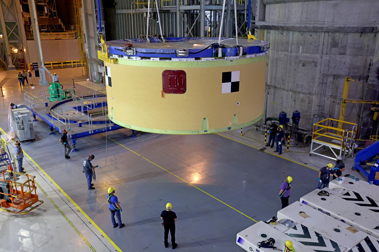 NASA’s Space Launch System (SLS) team fully stacked three hardware elements together May 24 to form the top of the rocket’s core stage for the Artemis II mission. NASA and core stage prime contractor Boeing connected the forward skirt with the liquid oxygen tank and intertank flight hardware inside an assembly area at NASA’s Michoud Assembly Facility in New Orleans. Teams had previously stacked the liquid oxygen tank and intertank on April 28. The joining of the three structures together is the first major assembly of core stage hardware for Artemis II, the first crewed Artemis mission and second flight of the SLS rocket. Next, technicians will work to complete outfitting and integrating the systems within the upper structure.   At 66 feet tall, the upper part of the stage is just a fraction of the entire core stage. The fully-assembled, 212-foot-tall rocket stage consists of five hardware elements, including two liquid propellant tanks and four RS-25 engines. The liquid oxygen tank in the upper portion of the stage will hold 196,000 gallons of liquid oxygen cooled to minus 297 degrees Fahrenheit. Meanwhile, the forward skirt and intertank house avionics, flight computer, and electronic systems for the rocket stage. Together, the core stage and its four RS-25 engines will provide more than 2 million pounds of thrust to help send Artemis II astronauts beyond Earth’s orbit to lunar orbit.   With Artemis, NASA will land the first woman and the first person of color on the Moon and establish sustainable exploration in preparation for missions to Mars. SLS and NASA’s Orion spacecraft, along with the commercial human landing system and the Gateway in orbit around the Moon, are NASA’s backbone for deep space exploration. SLS is the only rocket that can send Orion, astronauts, and supplies to the Moon in a single mission. Image credit: NASA/Michael DeMocker