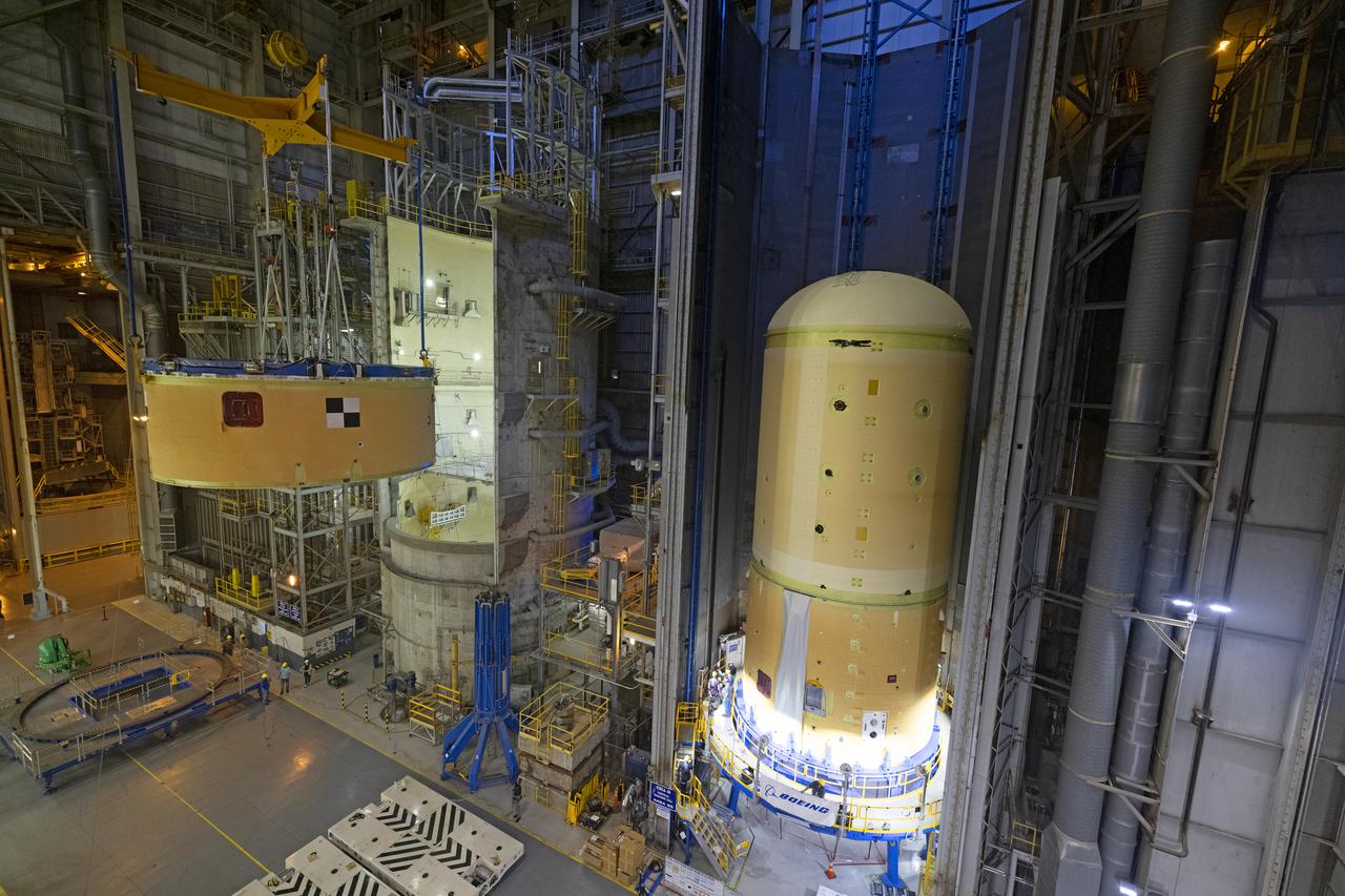 NASA’s Space Launch System (SLS) team fully stacked three hardware elements together May 24 to form the top of the rocket’s core stage for the Artemis II mission. NASA and core stage prime contractor Boeing connected the forward skirt with the liquid oxygen tank and intertank flight hardware inside an assembly area at NASA’s Michoud Assembly Facility in New Orleans. Teams had previously stacked the liquid oxygen tank and intertank on April 28. The joining of the three structures together is the first major assembly of core stage hardware for Artemis II, the first crewed Artemis mission and second flight of the SLS rocket. Next, technicians will work to complete outfitting and integrating the systems within the upper structure.   At 66 feet tall, the upper part of the stage is just a fraction of the entire core stage. The fully-assembled, 212-foot-tall rocket stage consists of five hardware elements, including two liquid propellant tanks and four RS-25 engines. The liquid oxygen tank in the upper portion of the stage will hold 196,000 gallons of liquid oxygen cooled to minus 297 degrees Fahrenheit. Meanwhile, the forward skirt and intertank house avionics, flight computer, and electronic systems for the rocket stage. Together, the core stage and its four RS-25 engines will provide more than 2 million pounds of thrust to help send Artemis II astronauts beyond Earth’s orbit to lunar orbit.   With Artemis, NASA will land the first woman and the first person of color on the Moon and establish sustainable exploration in preparation for missions to Mars. SLS and NASA’s Orion spacecraft, along with the commercial human landing system and the Gateway in orbit around the Moon, are NASA’s backbone for deep space exploration. SLS is the only rocket that can send Orion, astronauts, and supplies to the Moon in a single mission. Image credit: NASA/Michael DeMocker